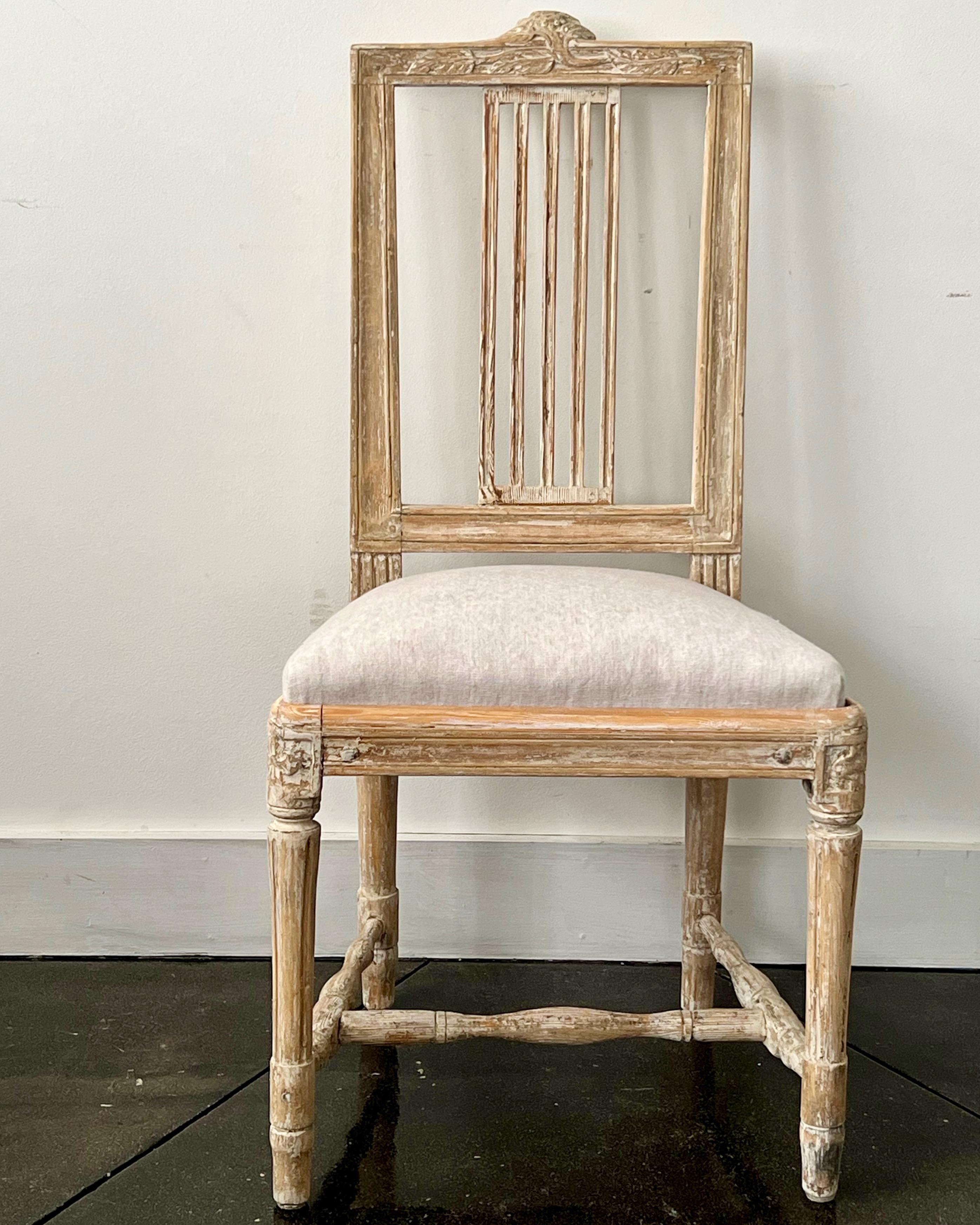 Gustavian period side chair, having the signature fruit and flower carving of the hops plant used by Lindome furniture makers. Hand scraped to the most original color and seat upholstered in pales of pale grey linen.

NOTE:
We have other 18th