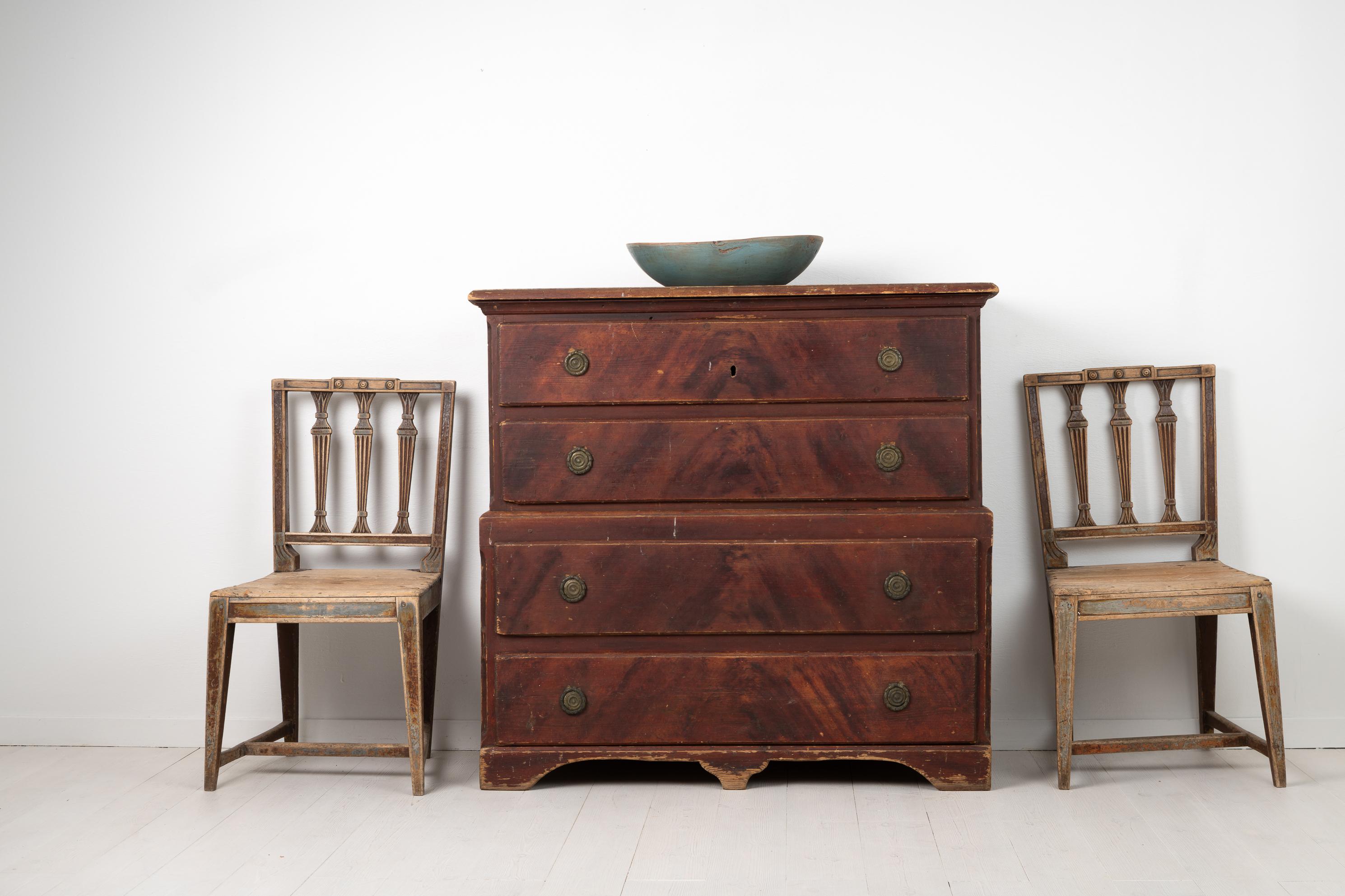 Gustavian chest on chest from the late 18th century, around 1790. The chest is from Northern Sweden and in two parts with a total of four drawers. The chest is in untouched original condition with the original faux paint that imitate mahogany.