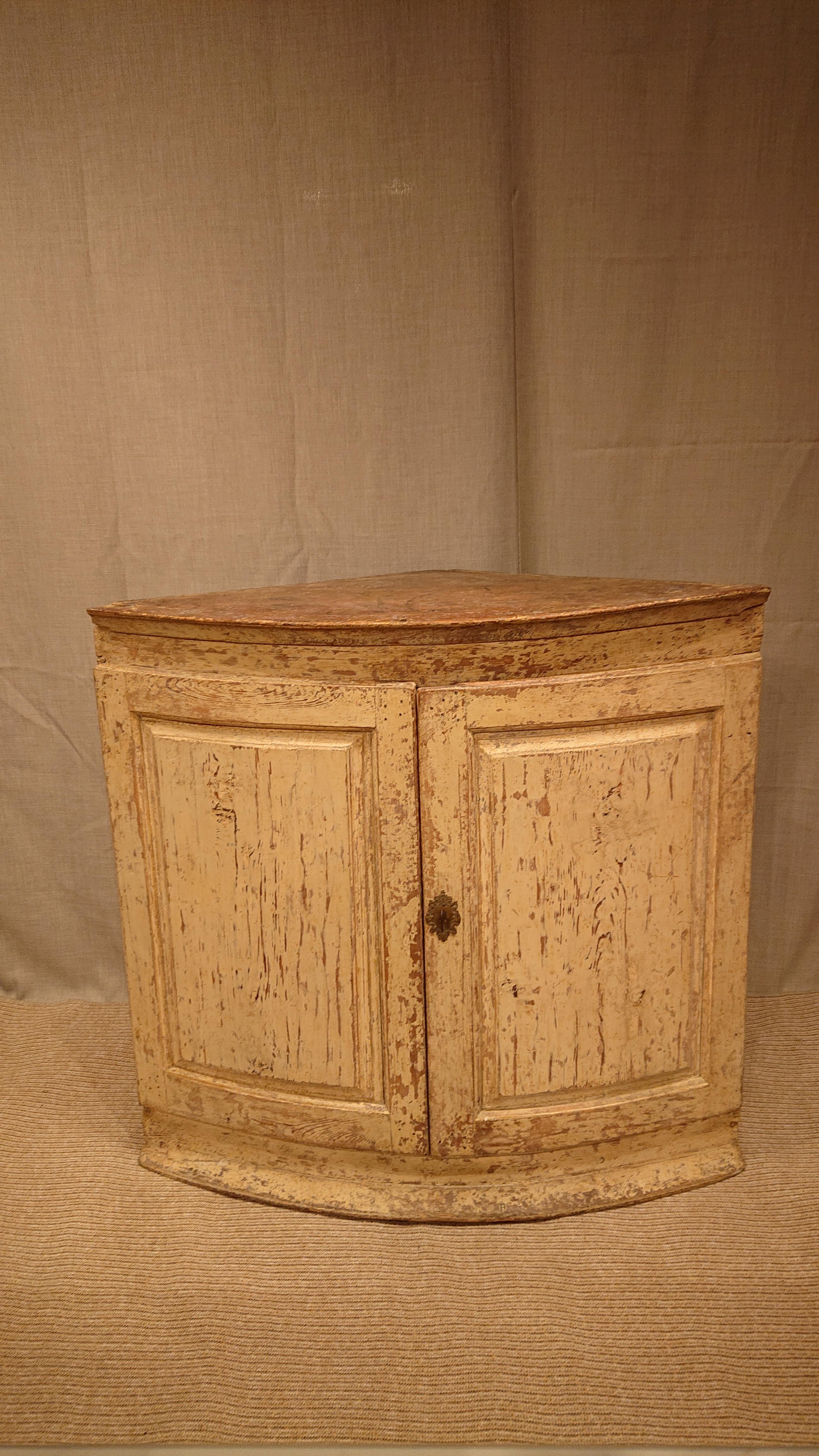 18th century Swedish late Baroque Corner cabinet from Lulea Norrbotten, Northern Sweden.
 A genuine and rustic cabinet with two doors.
Nice storage inside.
The hinges on left door were replaced during the 19th century.
Key lock and hardware