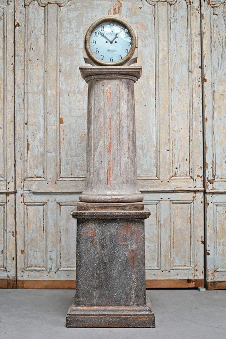 An exceptionally rare and fine Swedish early neoclassical period long case clock with fluted center column from the mid 18th century retaining its original blue paint surface, signed. The high quality movement is stamped J. Nyberg - Stockholm. J.
