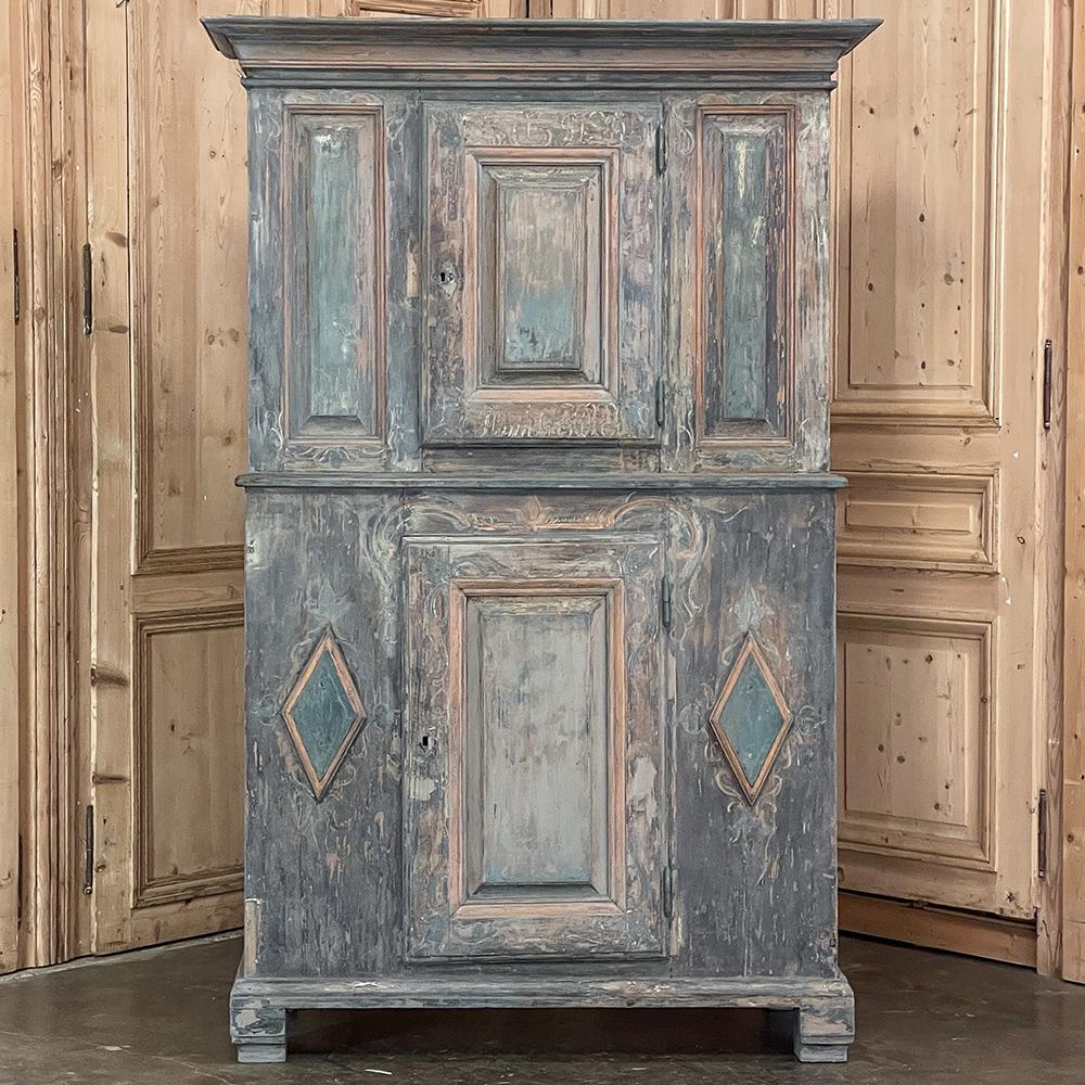 18th Century Swedish Painted Pine Two-Tiered Cabinet is ideal for the casual decor, providing both visual impact and abundant storage in one! The top tier is recessed several inches back from the bottom tier, and consists of three distinct panels,