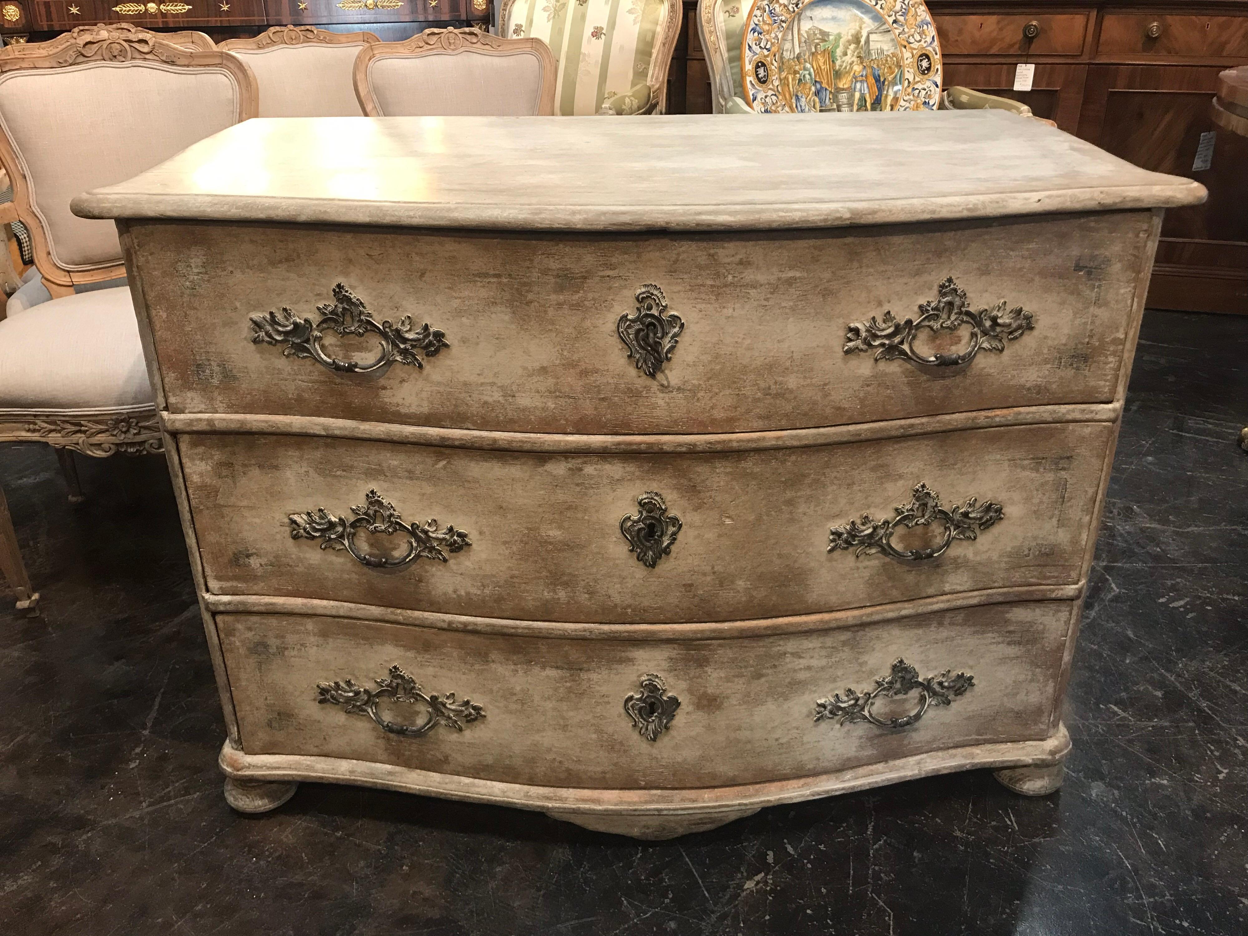 Beautiful 18th century Swedish painted commode with original heavy bronze hardware and large old locks. Shaped form and great painted finish which still shows faint geometric black border if you look closely. Very heavy well crafted and still