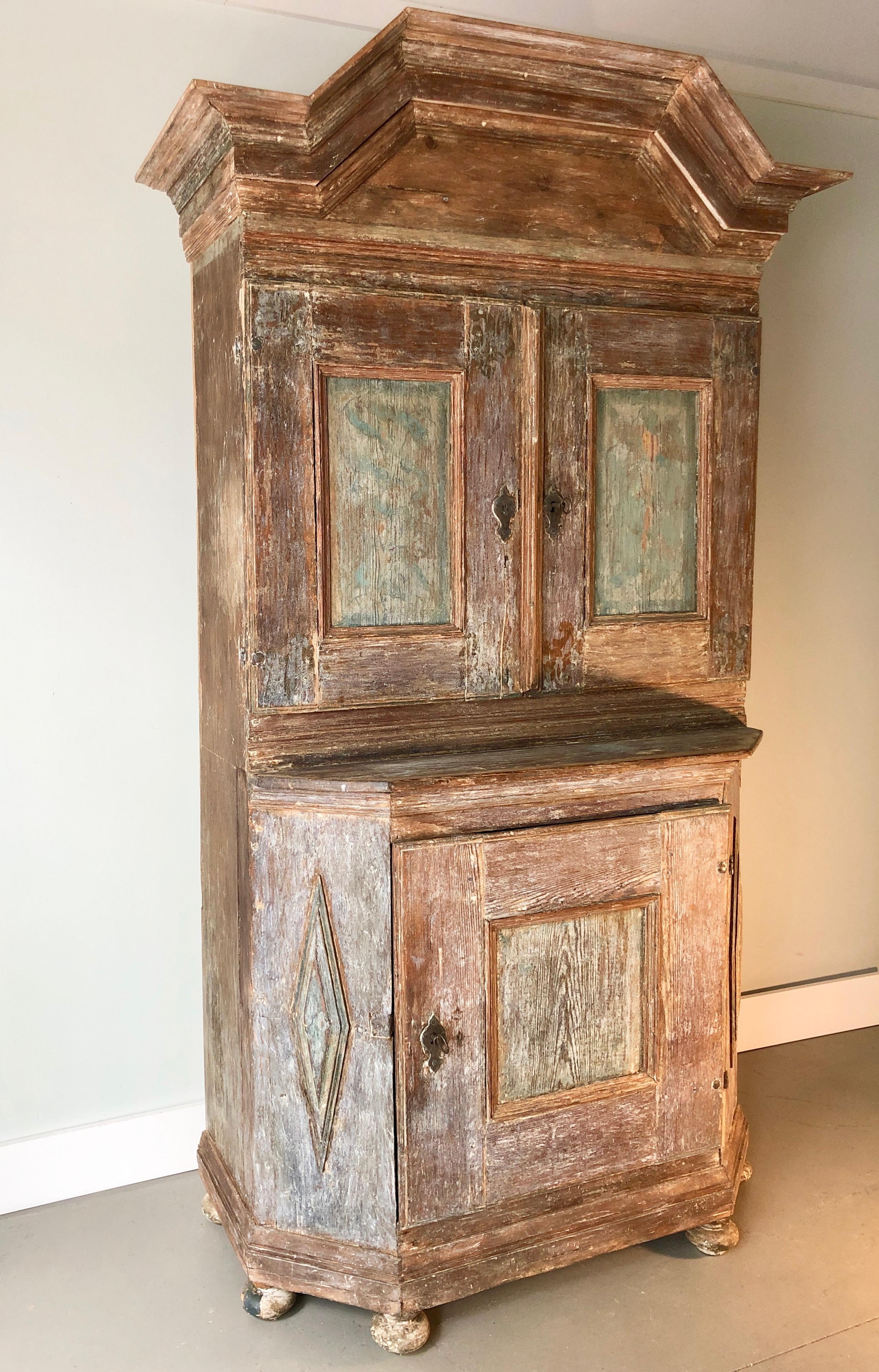 Handsome, 18th century Swedish period cabinet, circa 1750 with wonderful pediment cornice and carved cupboard doors, original iron hardware’s, two shelves, one shaped and notched for spoons. Rare and handsome piece for any room.
More than ever, we