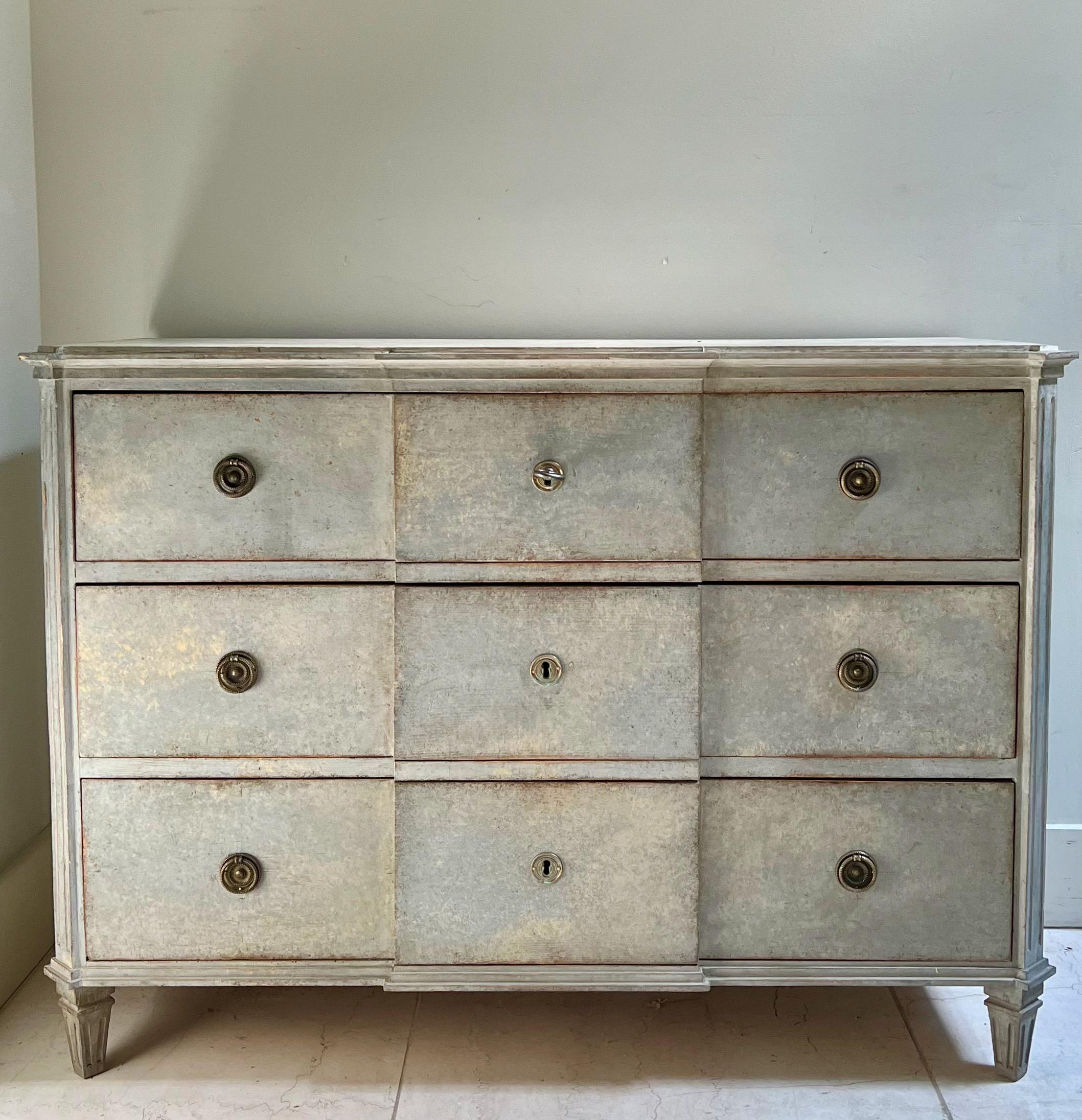 A handsome, large Swedish Gustavian period chest of drawers in wonderful later painted light blue. Canted corners, marbleized wooden shaped top on tapered short feet.
Stockholm, Sweden, 1800-1810.
 
 