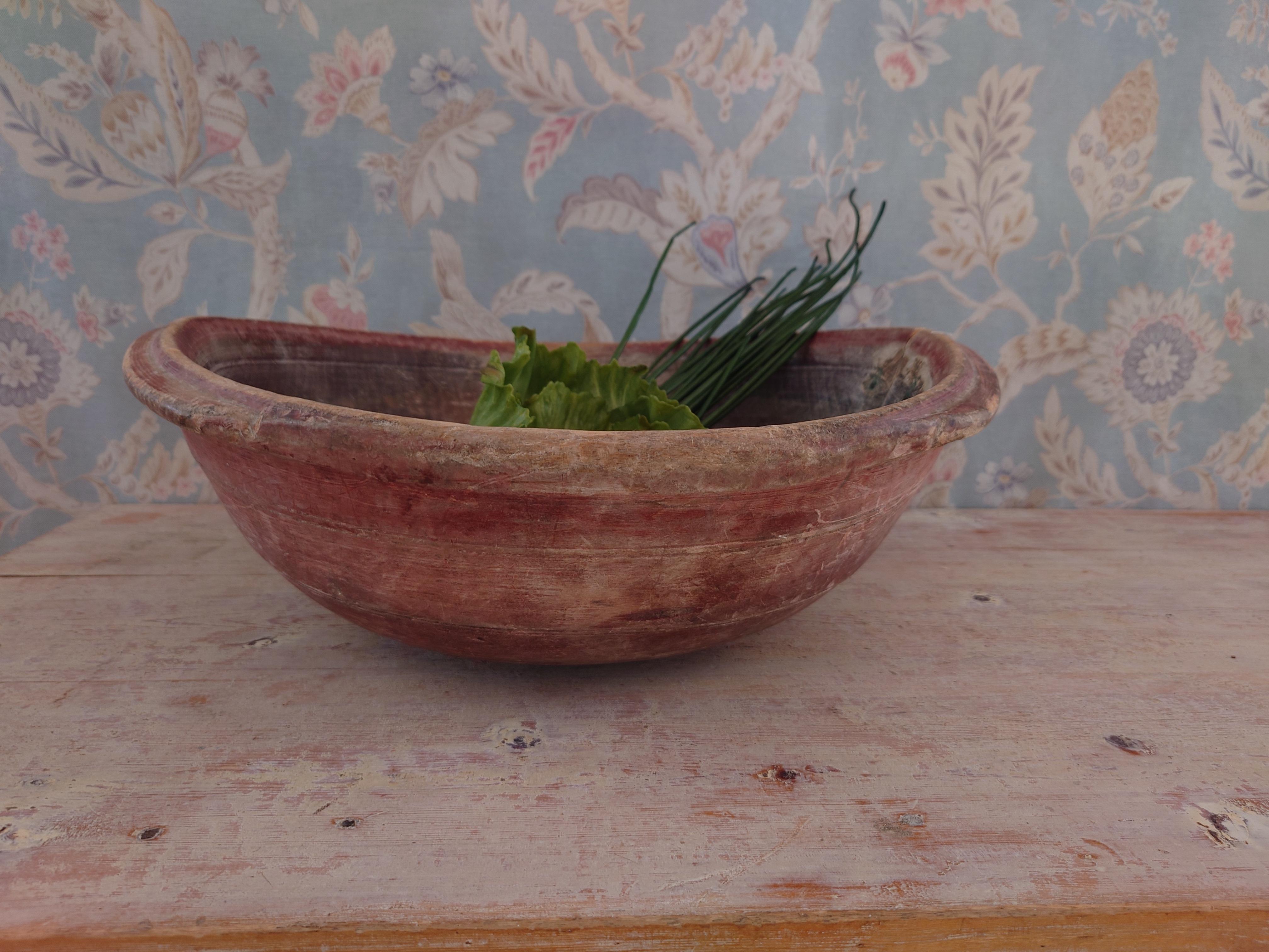 An antique and unique organic wooden bowl. With highly appealing patina, with traces of use. Produced in Sweden, 19th century.
The bowl has original paint.
Beautiful in any room,a real centerpiece.
These bowls where very important for many