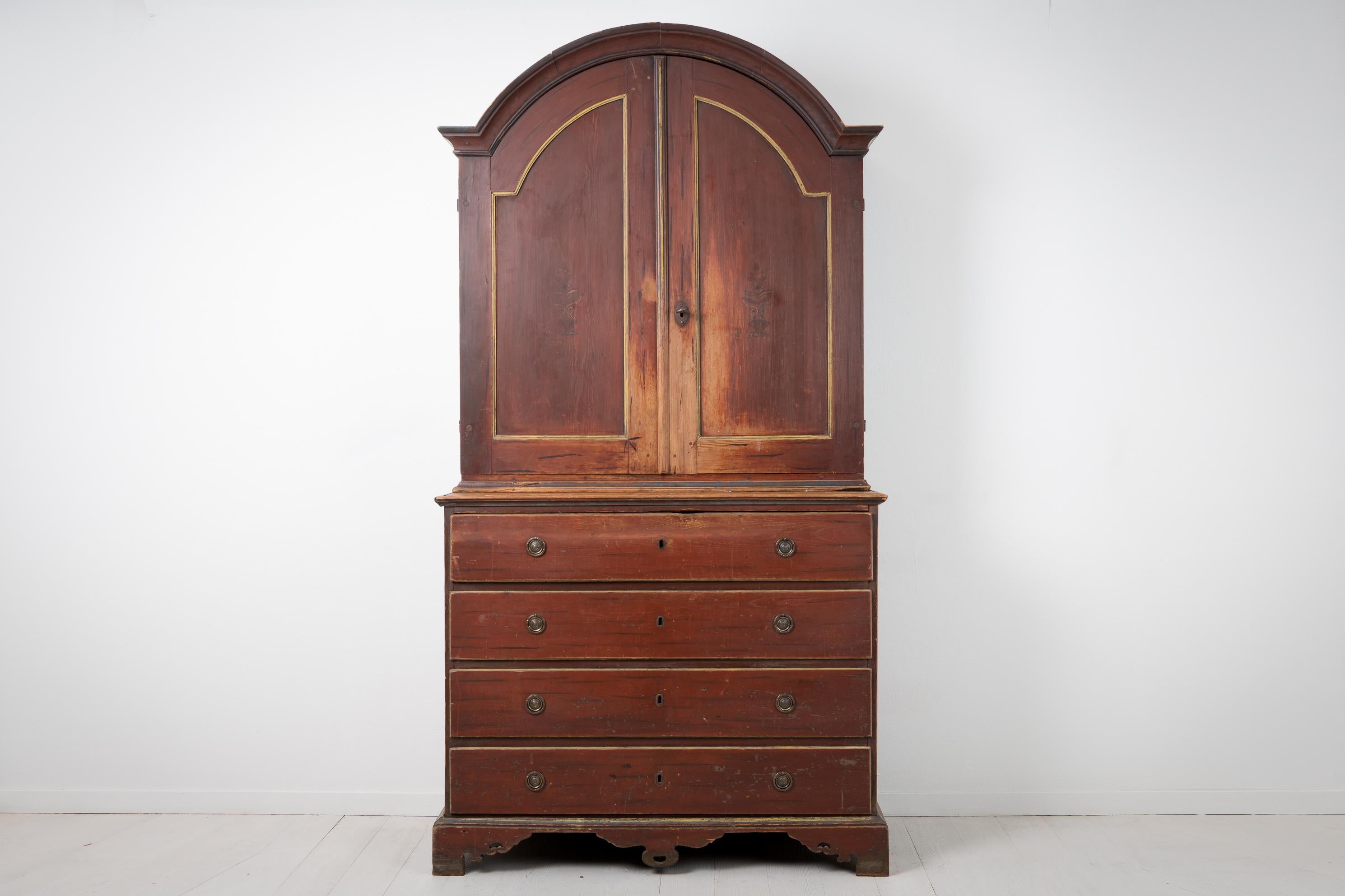 Swedish Rococo cabinet from the late 1700s. The cabinet is painted pine and the paint is the untouched original first paint from the late 1700s. The deep paint combined with a genuine 250 year old patina gives the cabinet a genuine warmth and