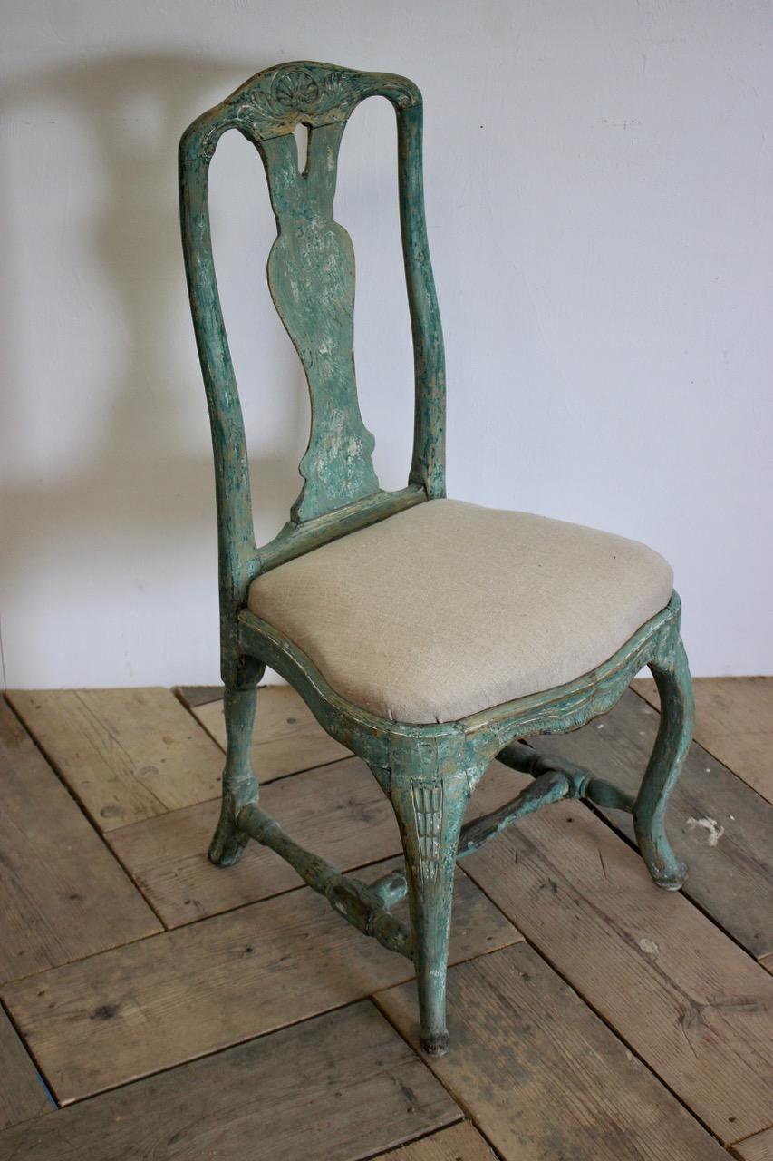A good quality and retaining the original paint, 18th century Rococo, Swedish chair, with a lovely color.