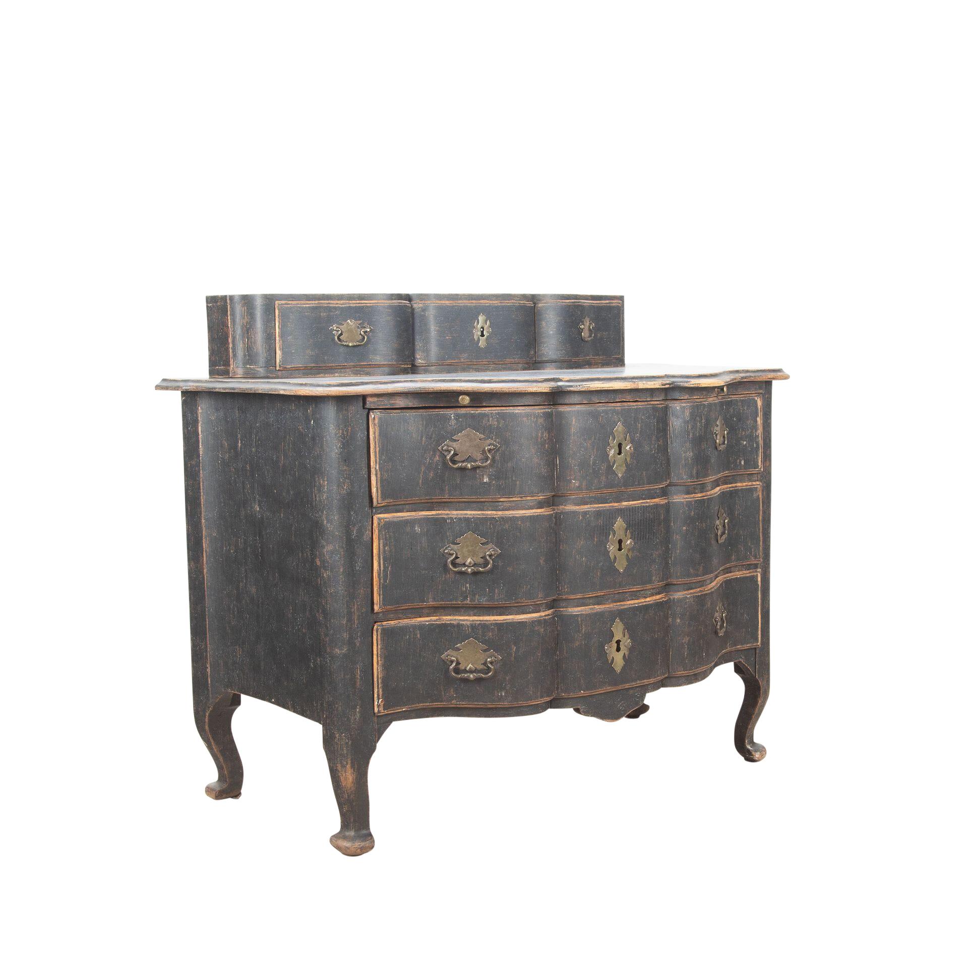 A large period Rococo commode made in Stockholm.
The top three drawers are original but optional and could be removed, below are three carved drawers. 
With original hardware in argent hache, later locks and repainted in soft black.
Height 81.5cm