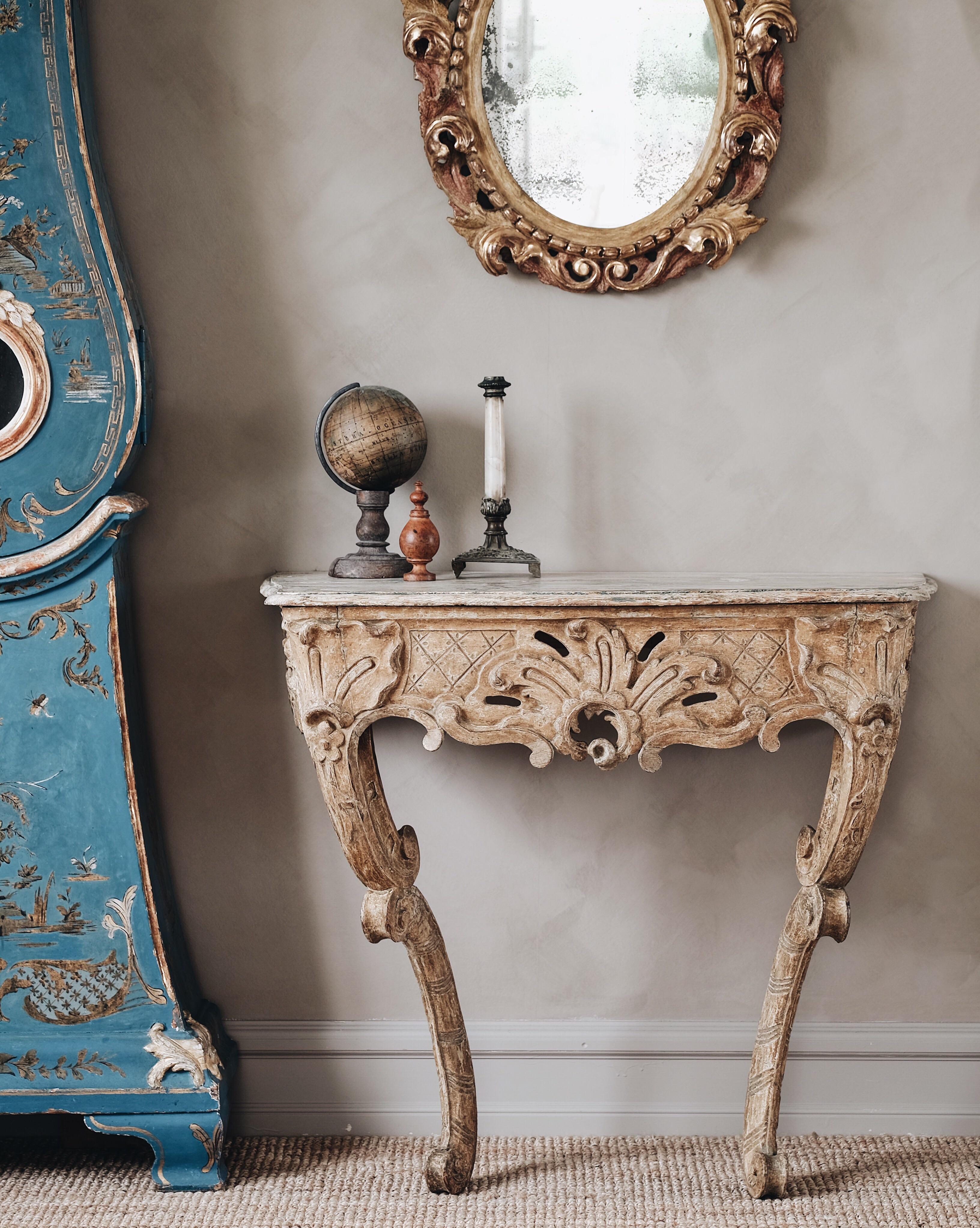 Exceptional and unusual 18th century Swedish Rococo console table in its original color, with fine carvings and proportions, circa 1760. 

Good condition with wear and tear consistent with age and use.