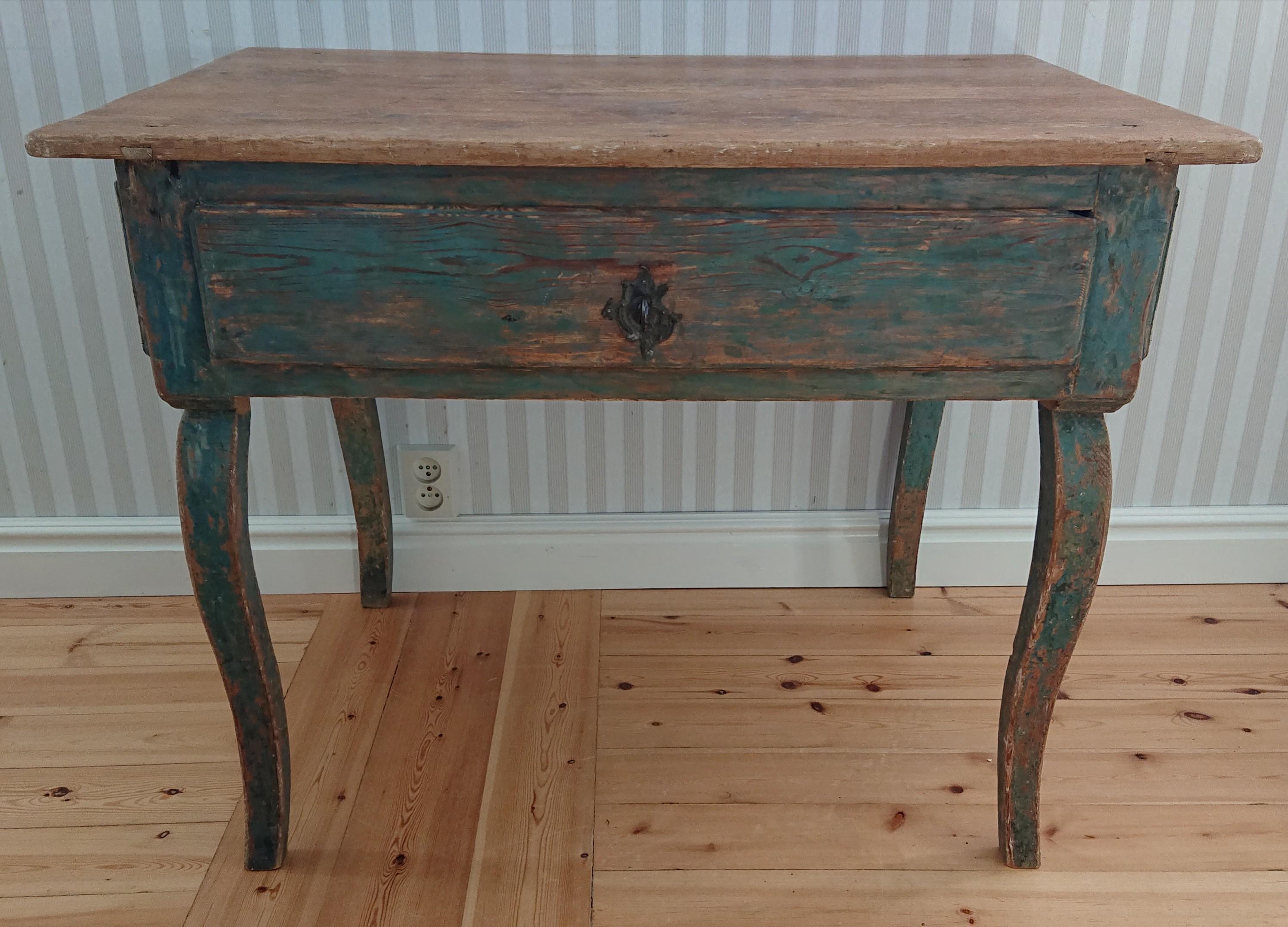 18th century Swedish Antique Rustic provincial rococo table/ desk from Boden Norrbotten, Northern Sweden.
A very rustic rococo desk with incredible patina. 
Handscraped to its originalcolor.
The table has retouches made by a Conservator.
An early
