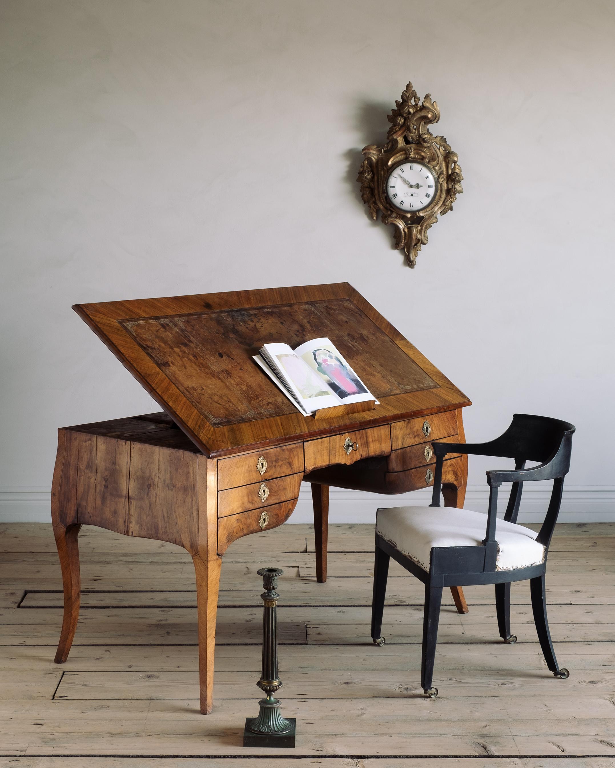 Most unusual and remarkable Swedish Rococo period metamorphic draughtsman's table with seven drawers, adjustable hinged top with book rest and retractable candle holders, circa 1760 Stockholm, Sweden.

Good condition with wear consistent with age