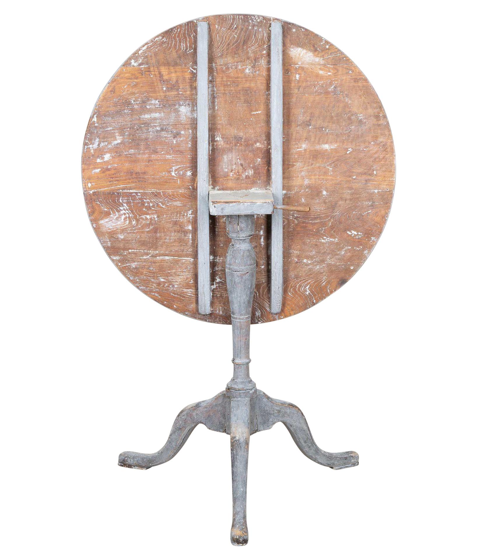 Late 18th Century Swedish Rococo folding table.
With decorative tripod base. Scraped back to secondary paint.