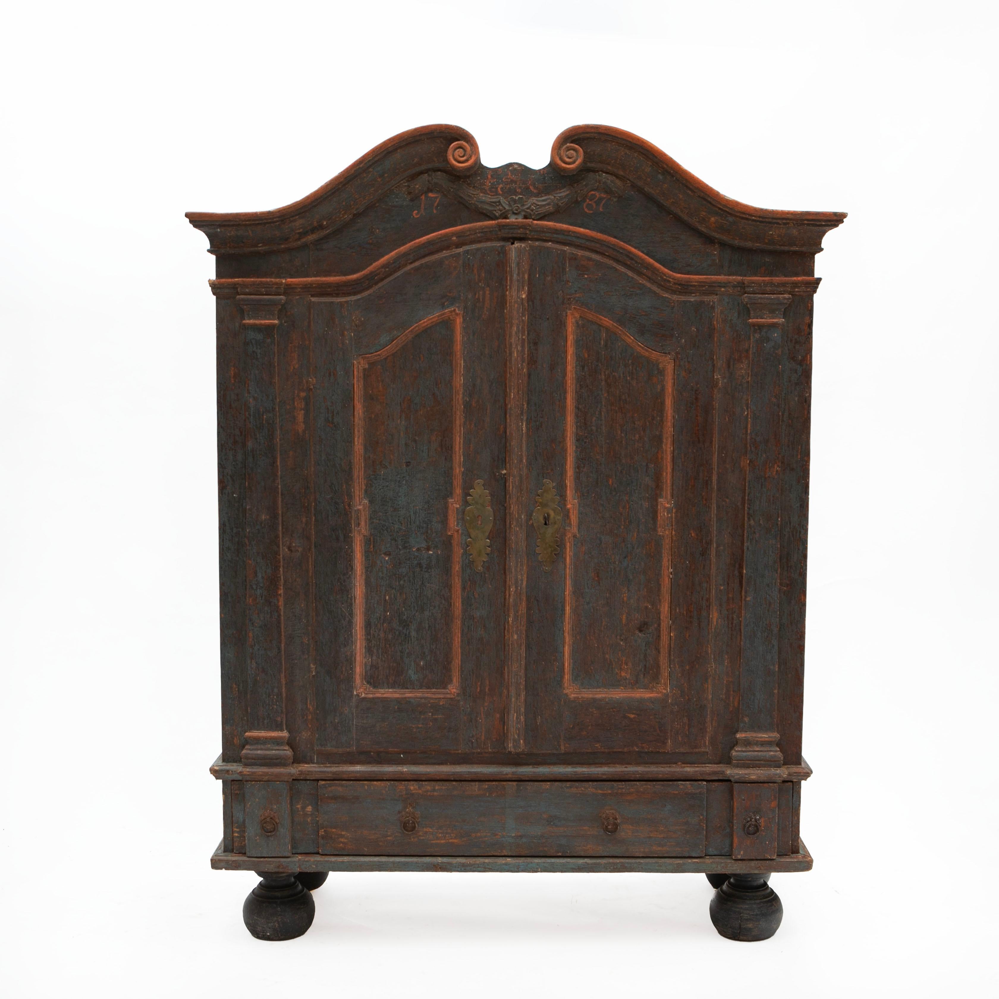 Danish rococo country cabinet in painted pine with an exceptionally beautiful original blue color contrasted by red lines.
The cabinet is restored by hand to the original first layer of paint (before images available upon request).
Features a swan