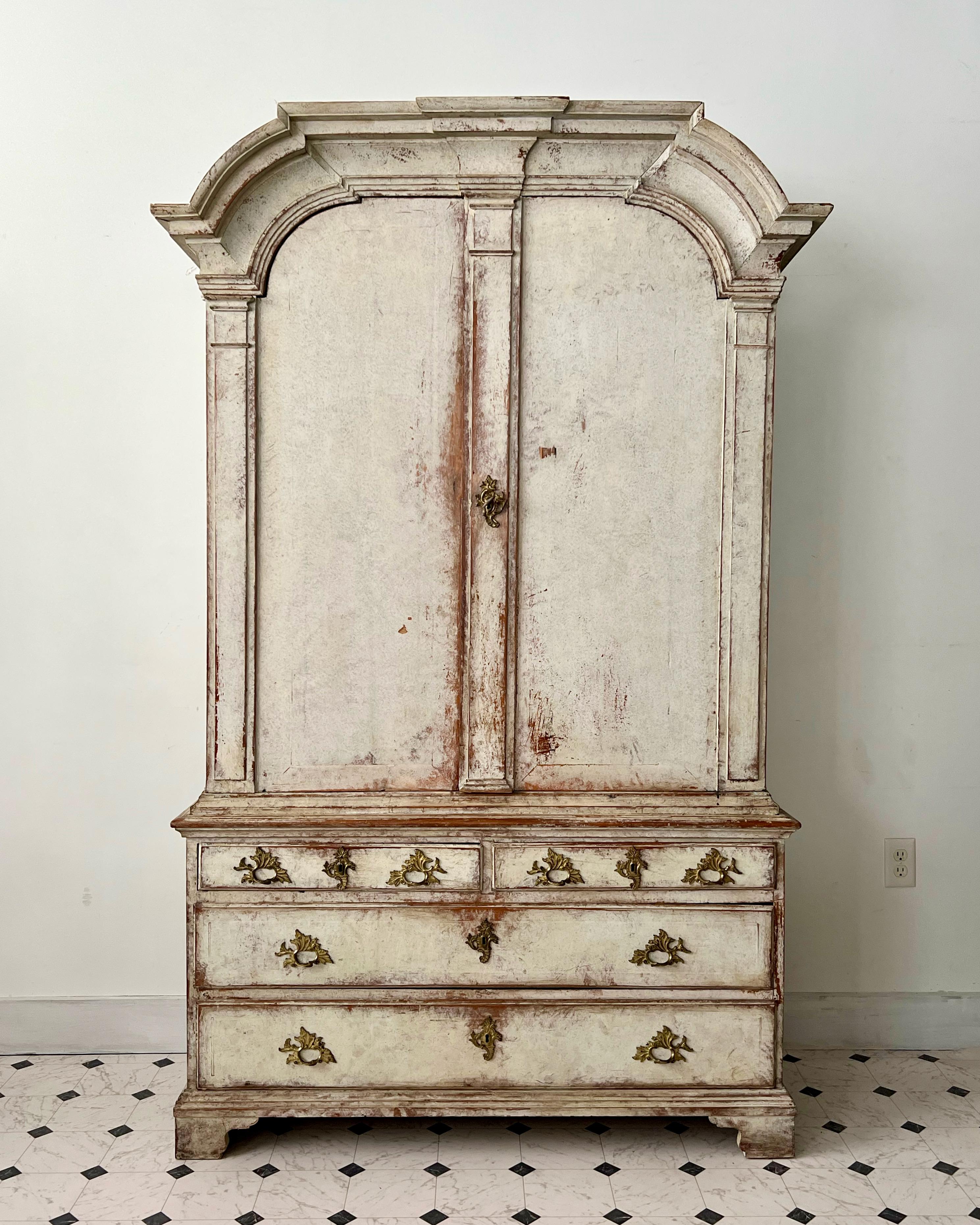 18th century Swedish Rococo Period Cabinet in two pieces with wonderful arched cornice and original hardwares .Upper unit features three shelves in blue patina. All resting on two smaller and two large drawer base.
Stockholm, Sweden, circa 1760.