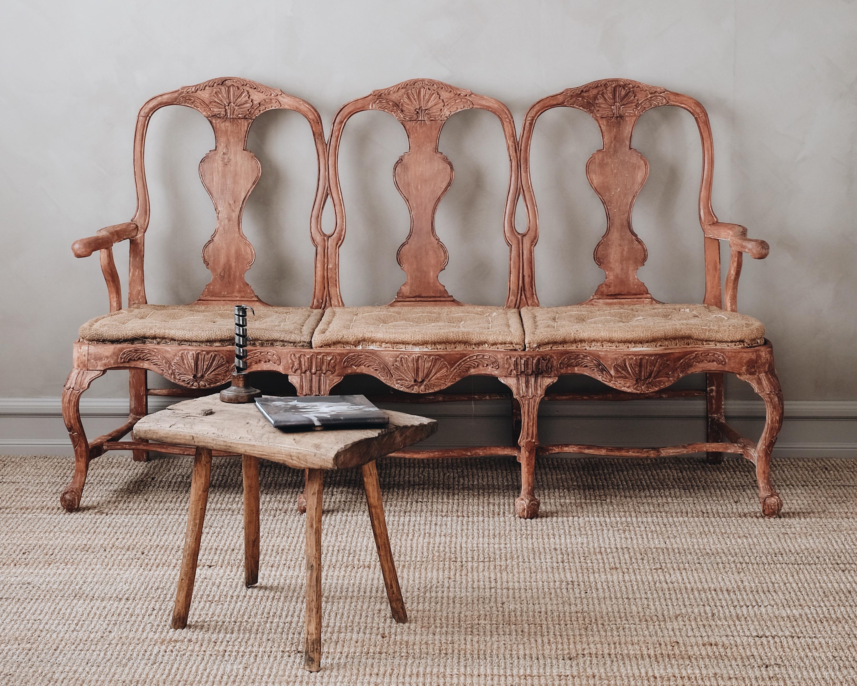 Fine 18th century Swedish Rococo three seat sofa/bench with fine carvings, original color, and padding. ca 1750. 

Good original condition with wear and tear consistent with age and use. 

