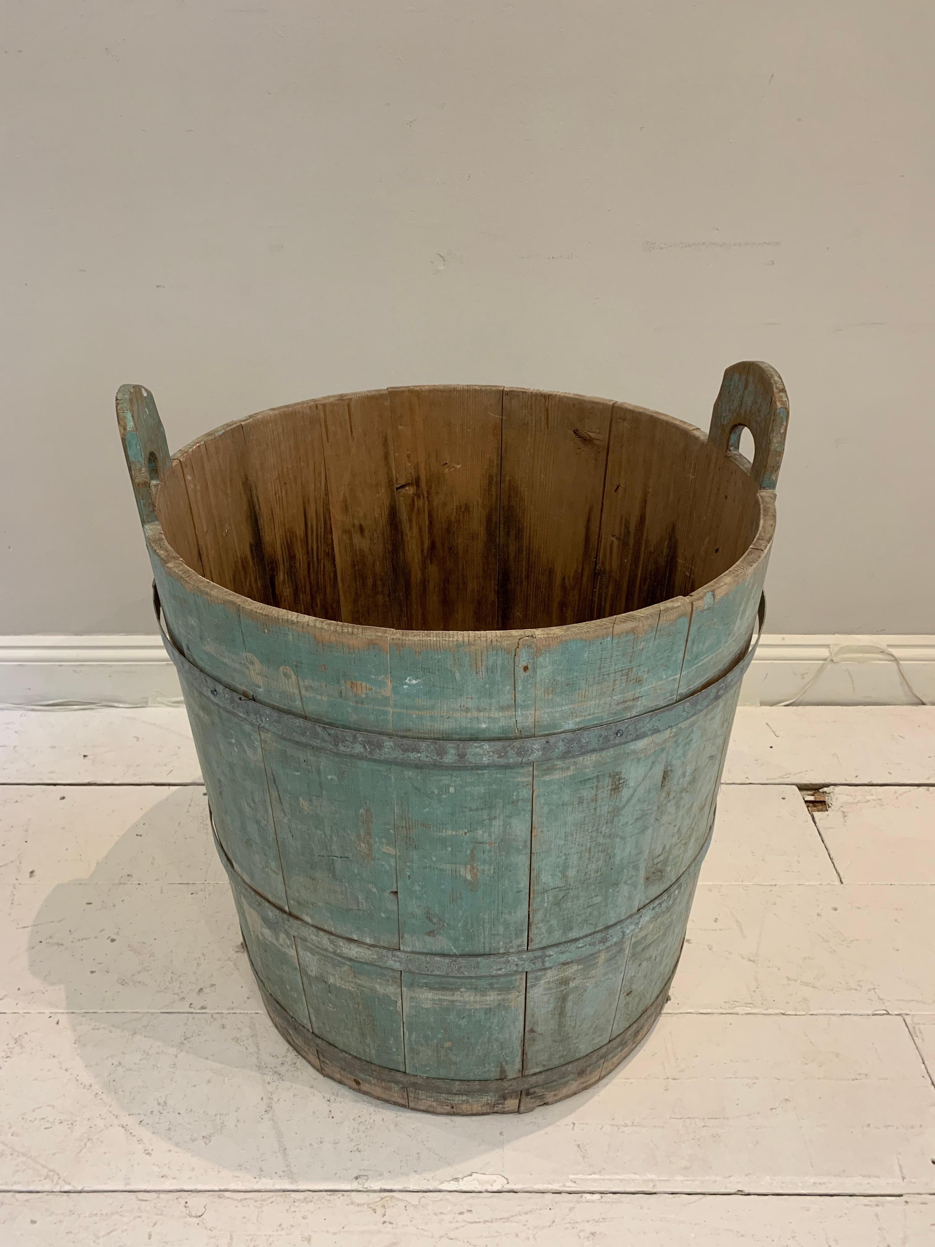 An 18th century Swedish rustic painted decorative handled barrel retaining its wonderful original blue colour with contrasting natural unpainted wood inside. A beautiful piece perfect as a decorative piece on its own or with a large plant/tree