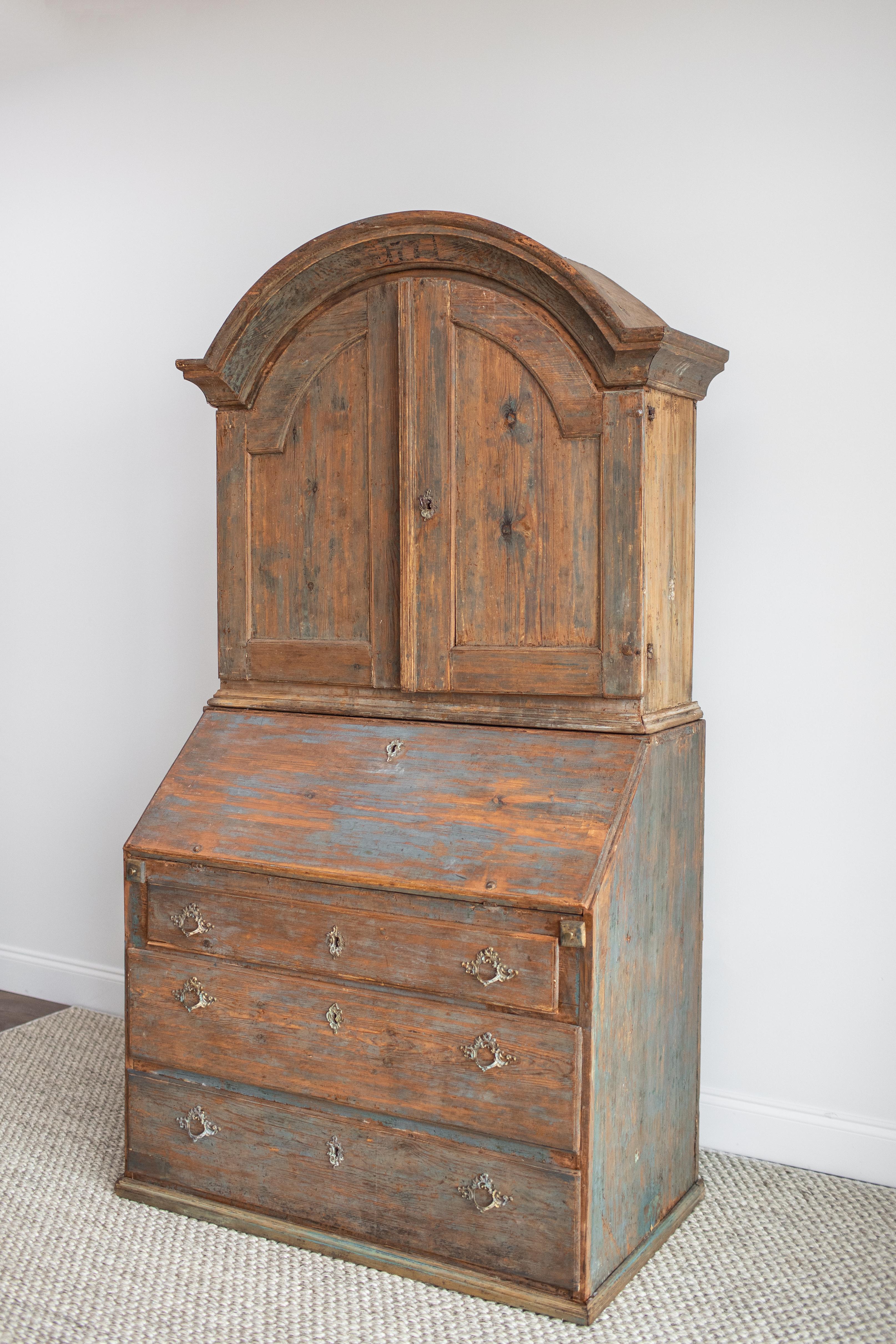This beautiful 18th century Swedish secretary has the original finish and hardware. The finish is a grey/blue color. The condition is fair. It has two interior shelves and three drawers.