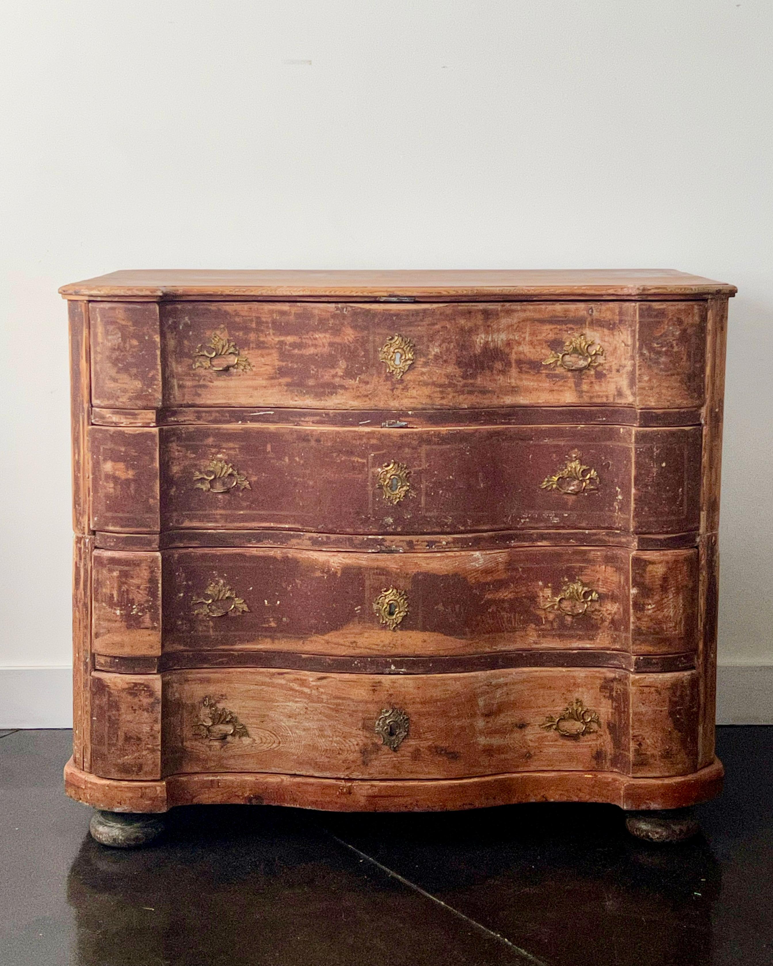An exceptional 18th century Swedish chest in original time worn paint with beautifully carved serpentine drawer fronts with original handsome bronze hardwares and shaped top. The chest is in two parts with original large handsome handles for convent