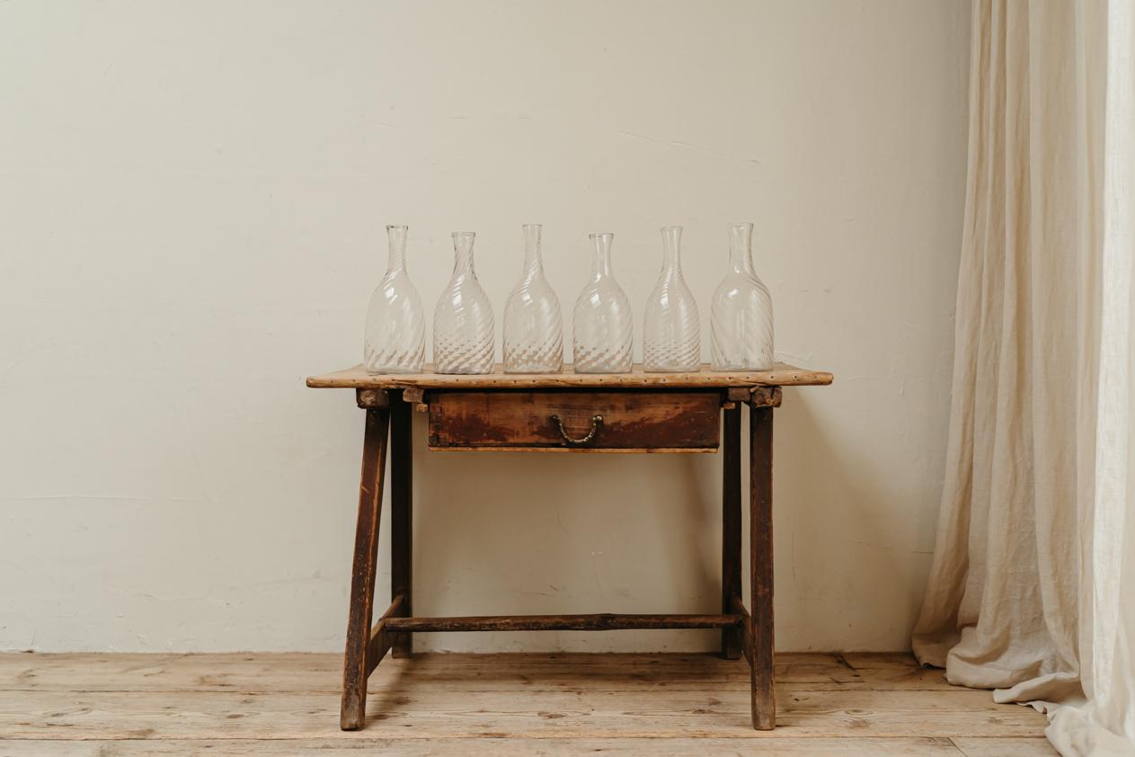 I love these 18th century Swedish carafes, they have become a very rare find, so delicate and yet such a strong decorative piece on the table. Here we have a set of 6,
dimensions are 27 or 29 cm high x 12 cm diameter.