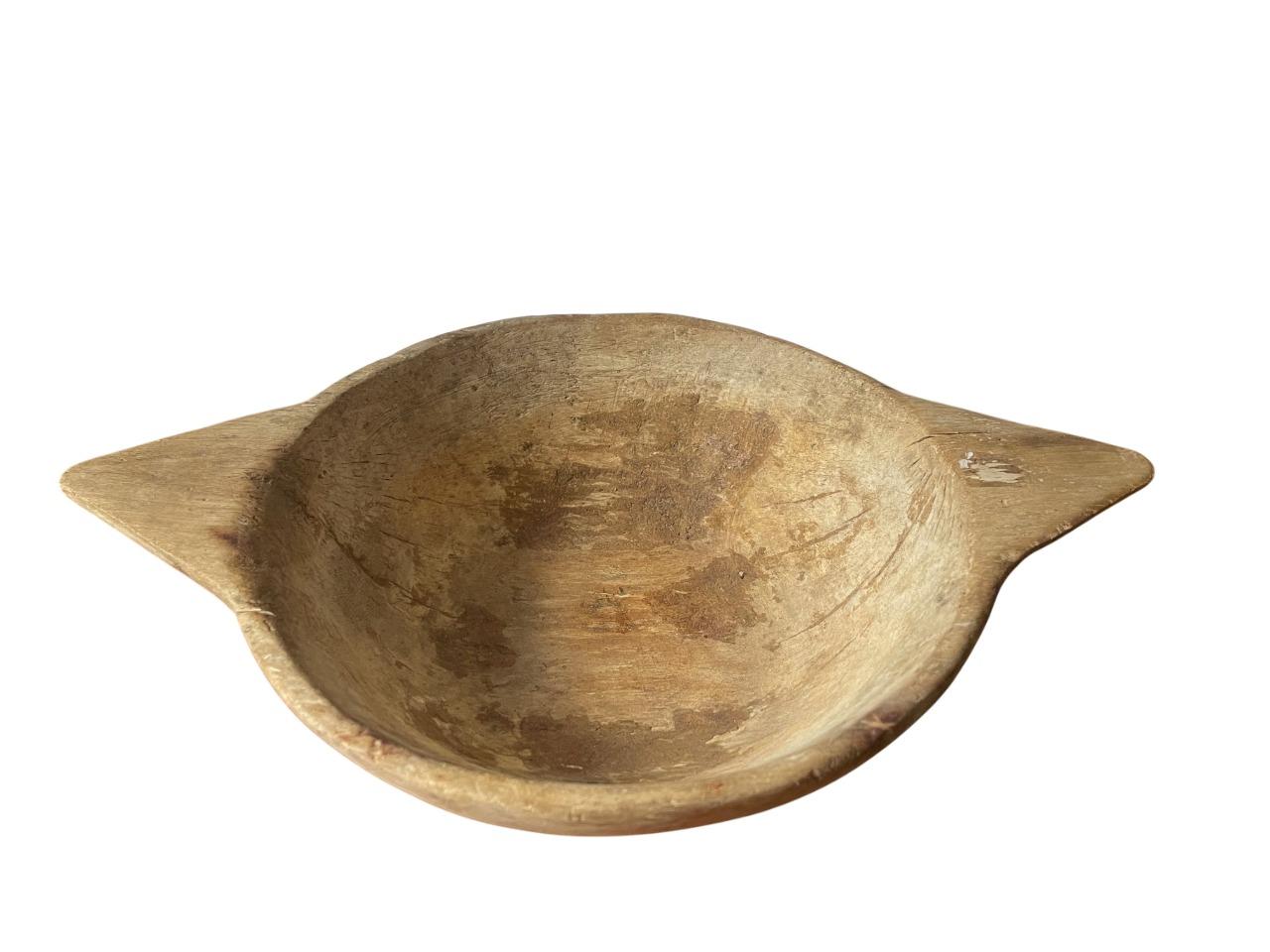 A rare and soulful 18th-century (or earlier) Swedish hand-carved wooden bowl, accompanied by its original iron cannonball used for crushing mustard seeds—a functional and historical pairing seldom found together. This rustic bowl embodies the