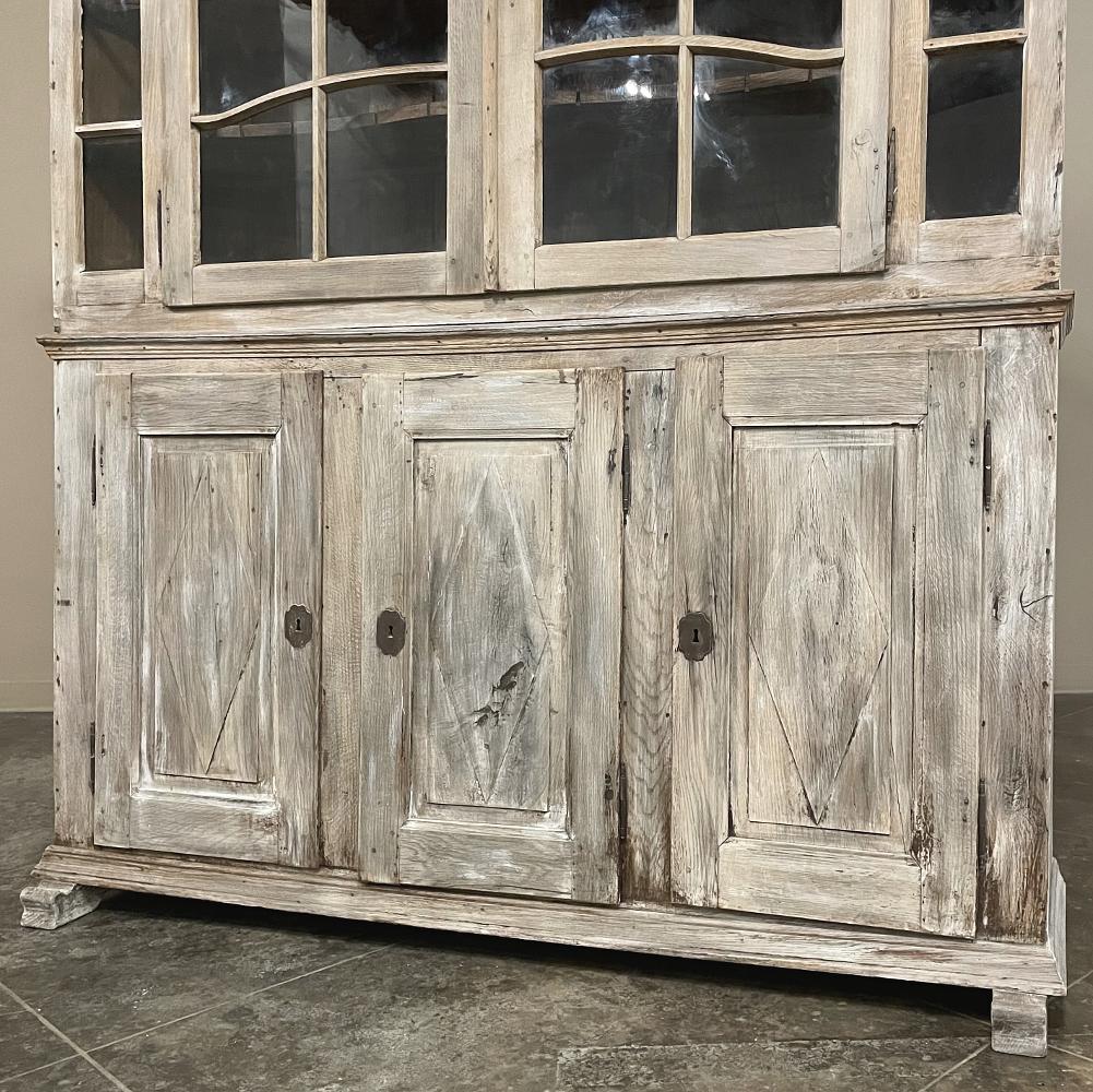 18th Century Swedish whitewashed bookcase ~ display cabinet will make a charming addition to your rustic or casual decor! Hand-crafted from old-growth oak during the Gustavian Period, it features tailored architecture that includes an arched crown