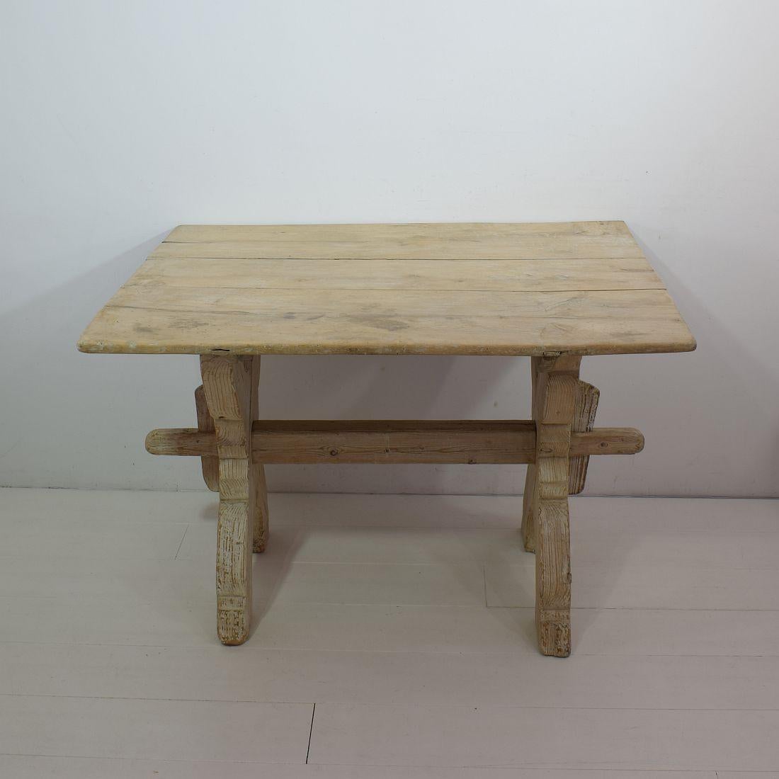 Beautiful X-frame bock board trestle table with faded traces of white paint.
Sweden, 18th century. Weathered small losses and old repairs. Old inactive woodworm holes visible.
More pictures available on request.