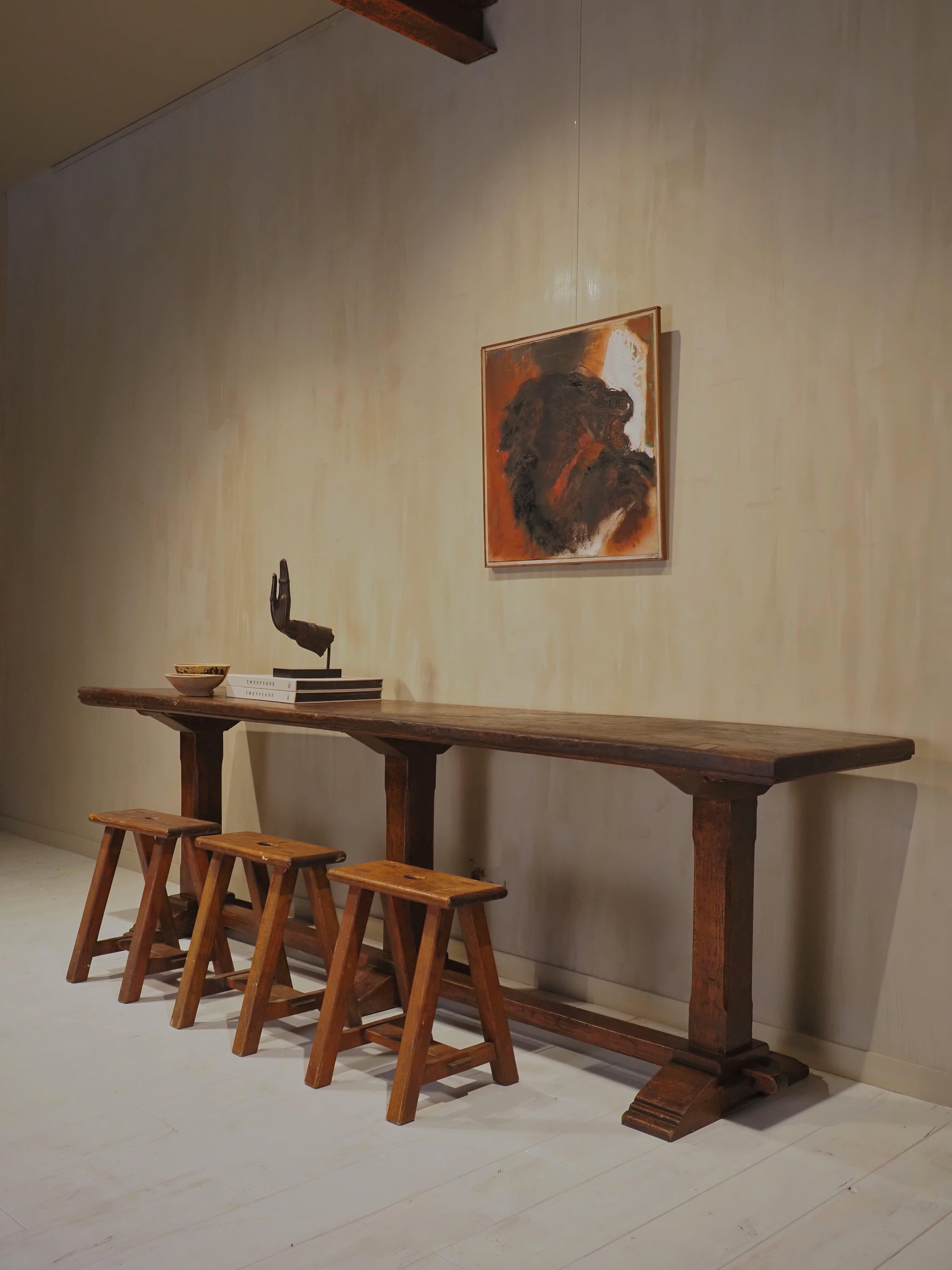 Originating from a Roman palazzo

This elegant wooden table features a rich, weathered patina that adds character and warmth to any space.The clean lines and natural texture make it a versatile piece ideal as a dining table, hallway console, or
