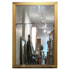 Grand miroir ancien doré Louis XVI du XVIIIe siècle