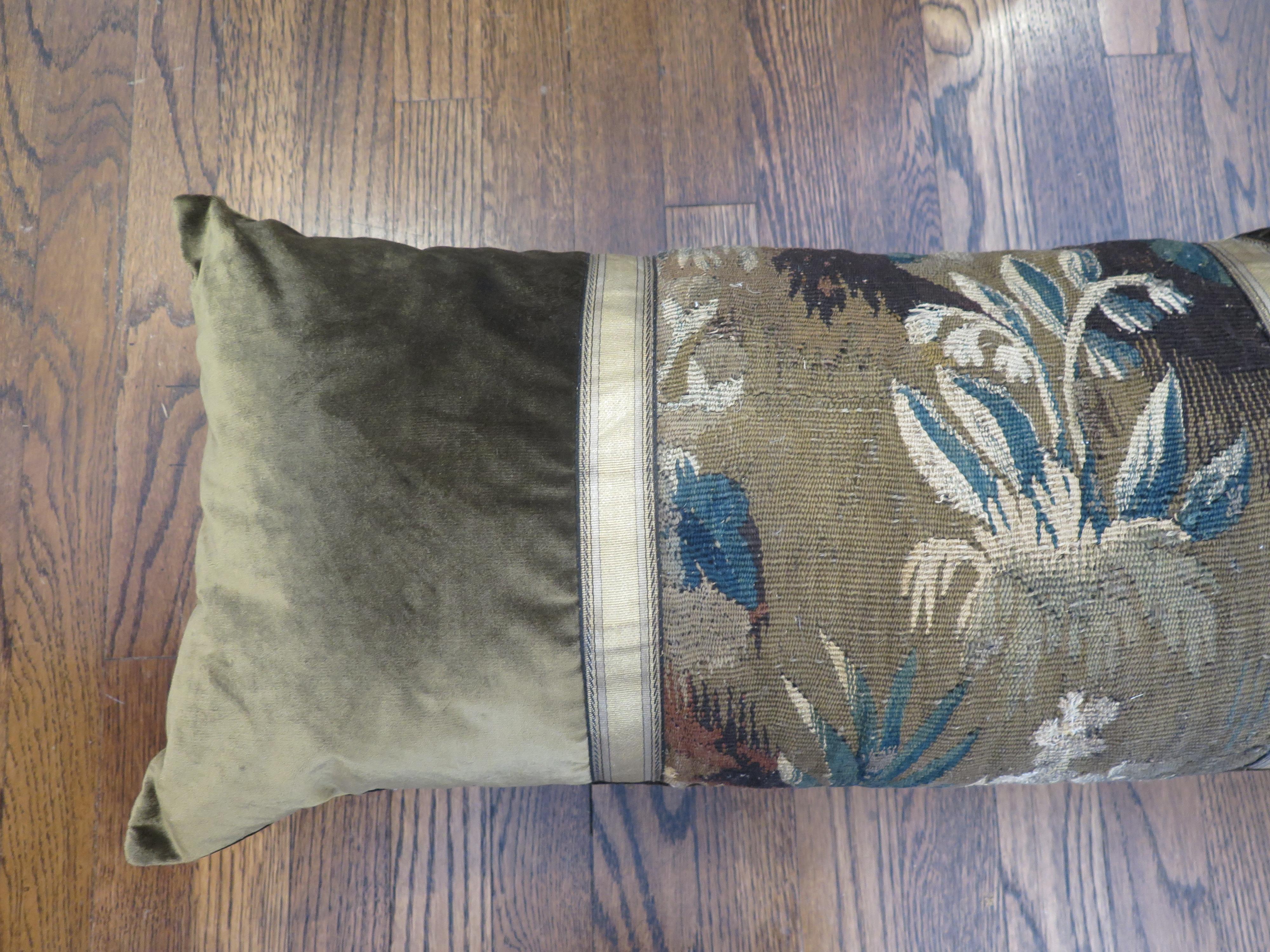 Custom 18th century tapestry pillow with beautiful gold ribbon. Pillow is constructed out of a dark olive silk velvet. Down filled.