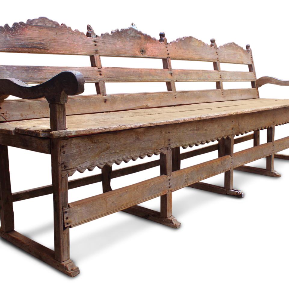 A stunning 18th century Indo-Portuguese bench from Goa. In excellent original condition, this teak bench stands as a testament to its enduring quality, having weathered the years with grace. Remarkably free from any previous repairs, it proudly