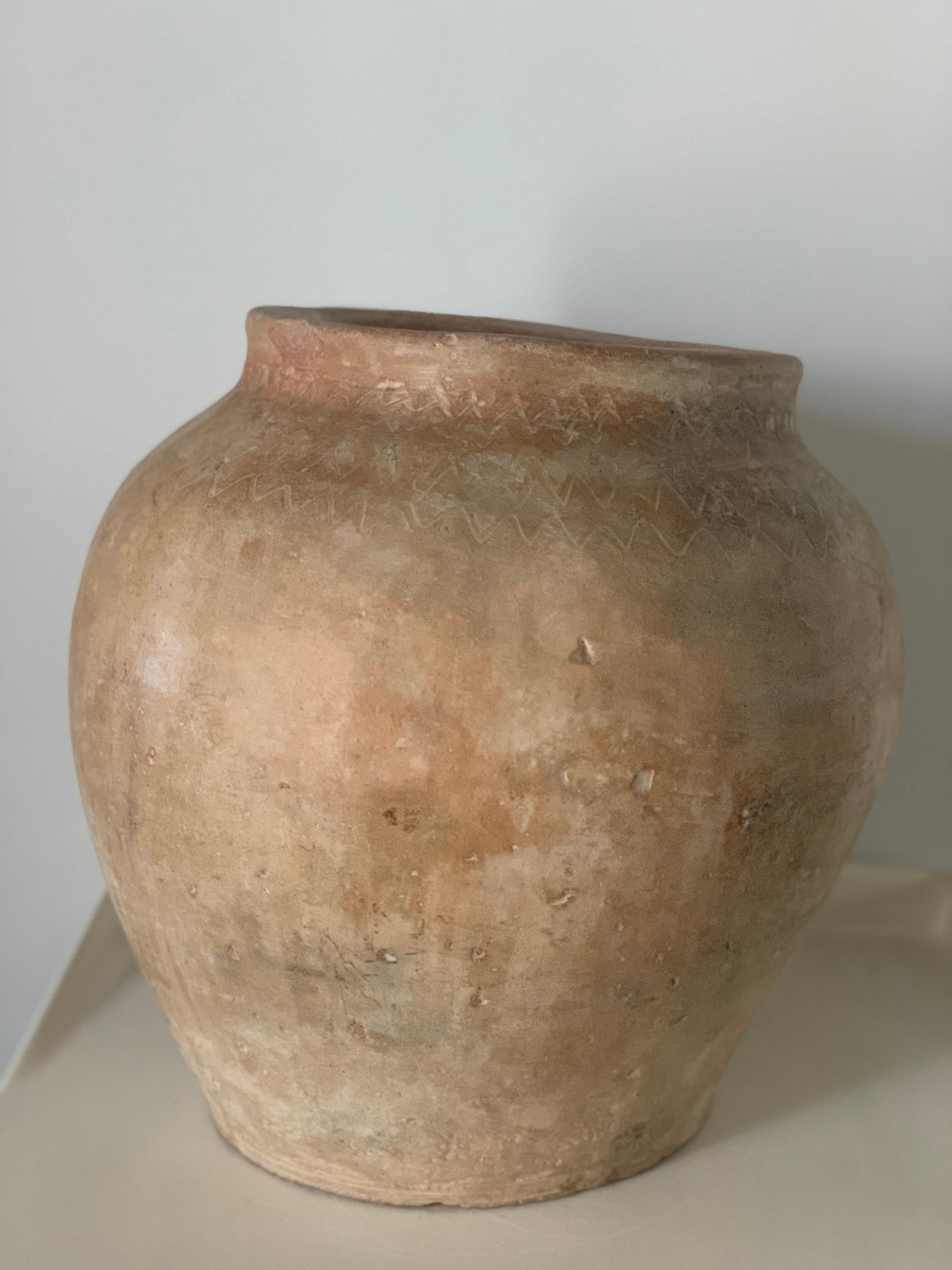 This fabulous handmade terracotta pot originated in Teruel, was used to store olive oil. In perfect condition and excellent patina.
These pots make an elegant statement around a pool and are magnificent in a grouping, perhaps by the entrance to