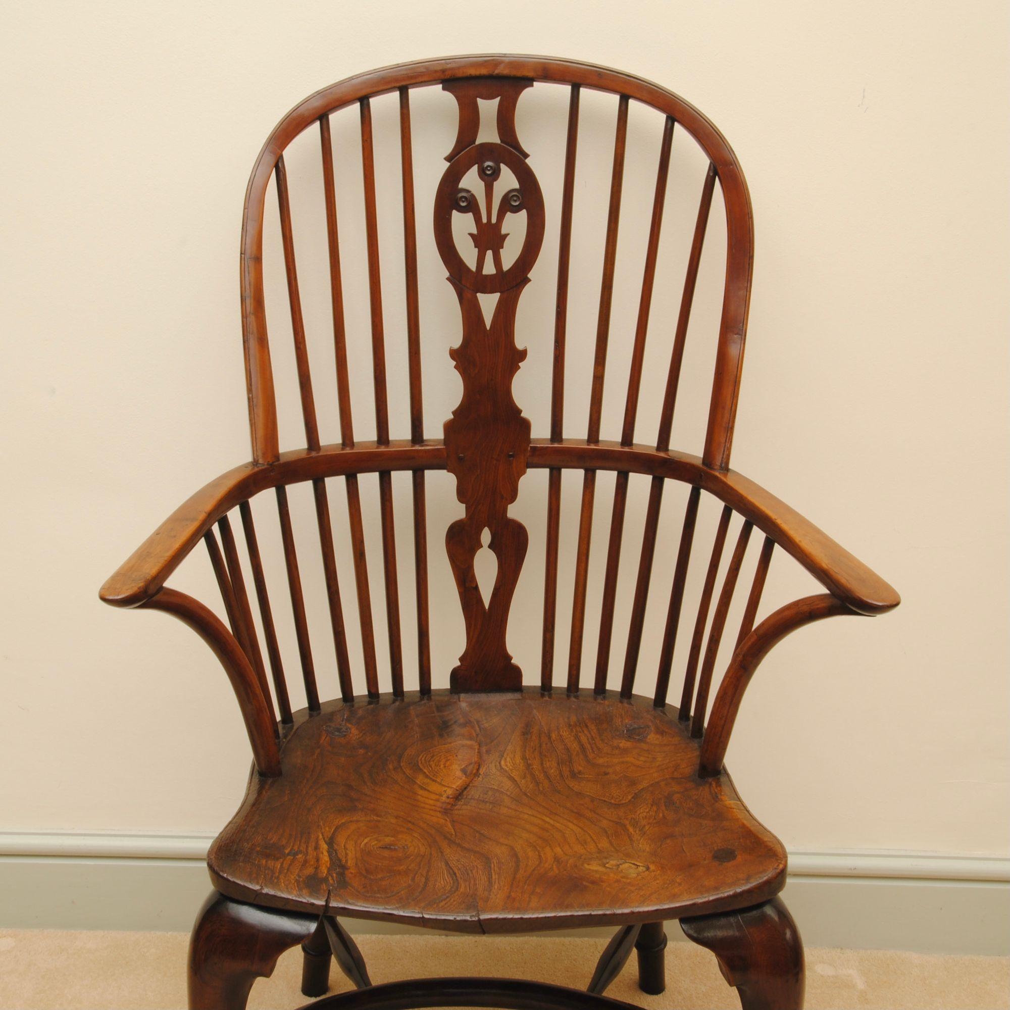 A super large example of a thames valley yew wood windsor armchair by Prior of Uxbridge stamped twice on the edge of the seat. The back splat with prince of wales feathers, the front cabriole legs have pad feet.
 

   