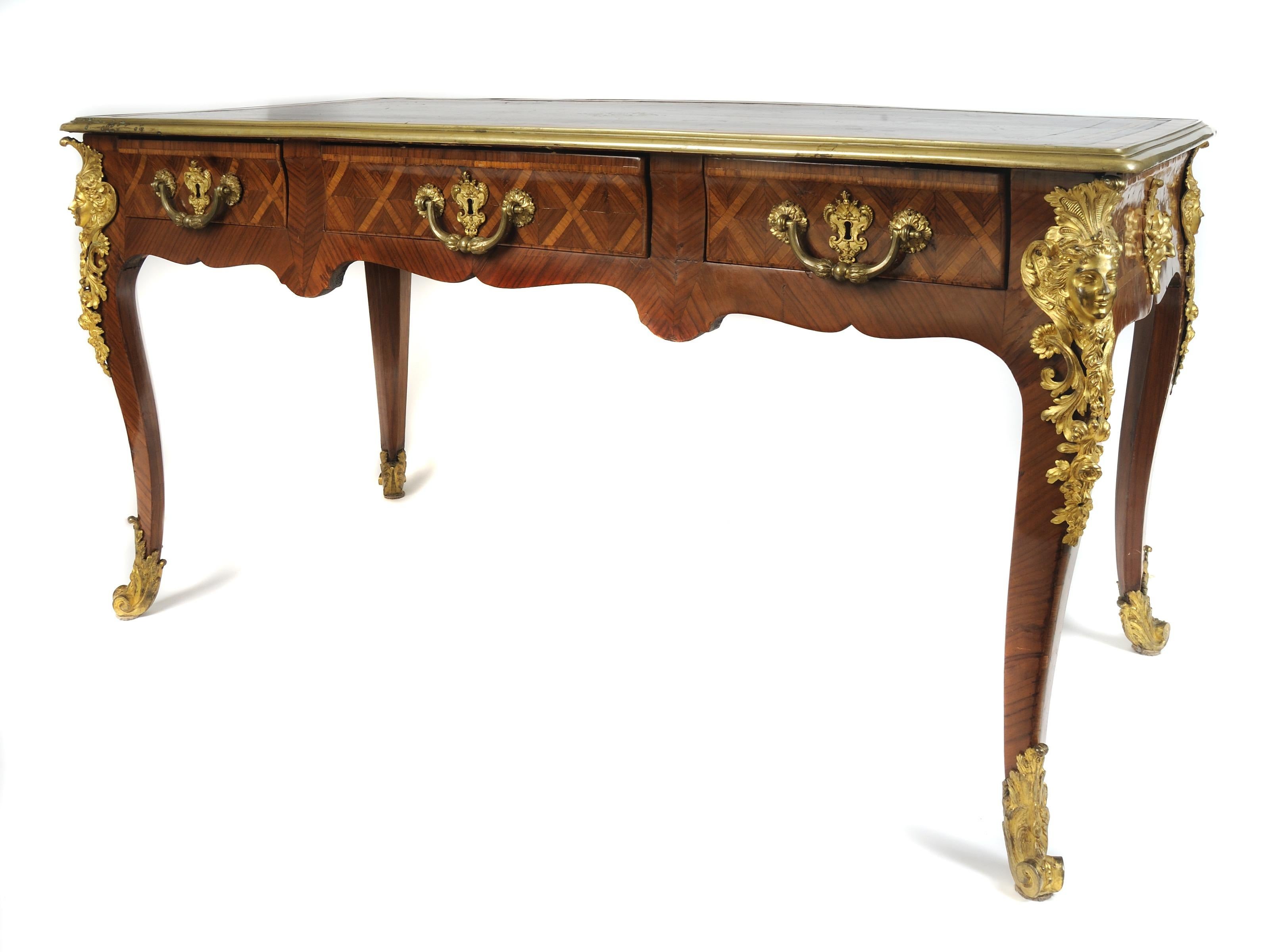 18th century three-drawer French gilt-embellished bureau-plat, circa 1725
Attributed to Noel Gerard (French 1690-1786)
Tulipwood with kingwood inlays and gilt bronze appliques
Measures: 30.5