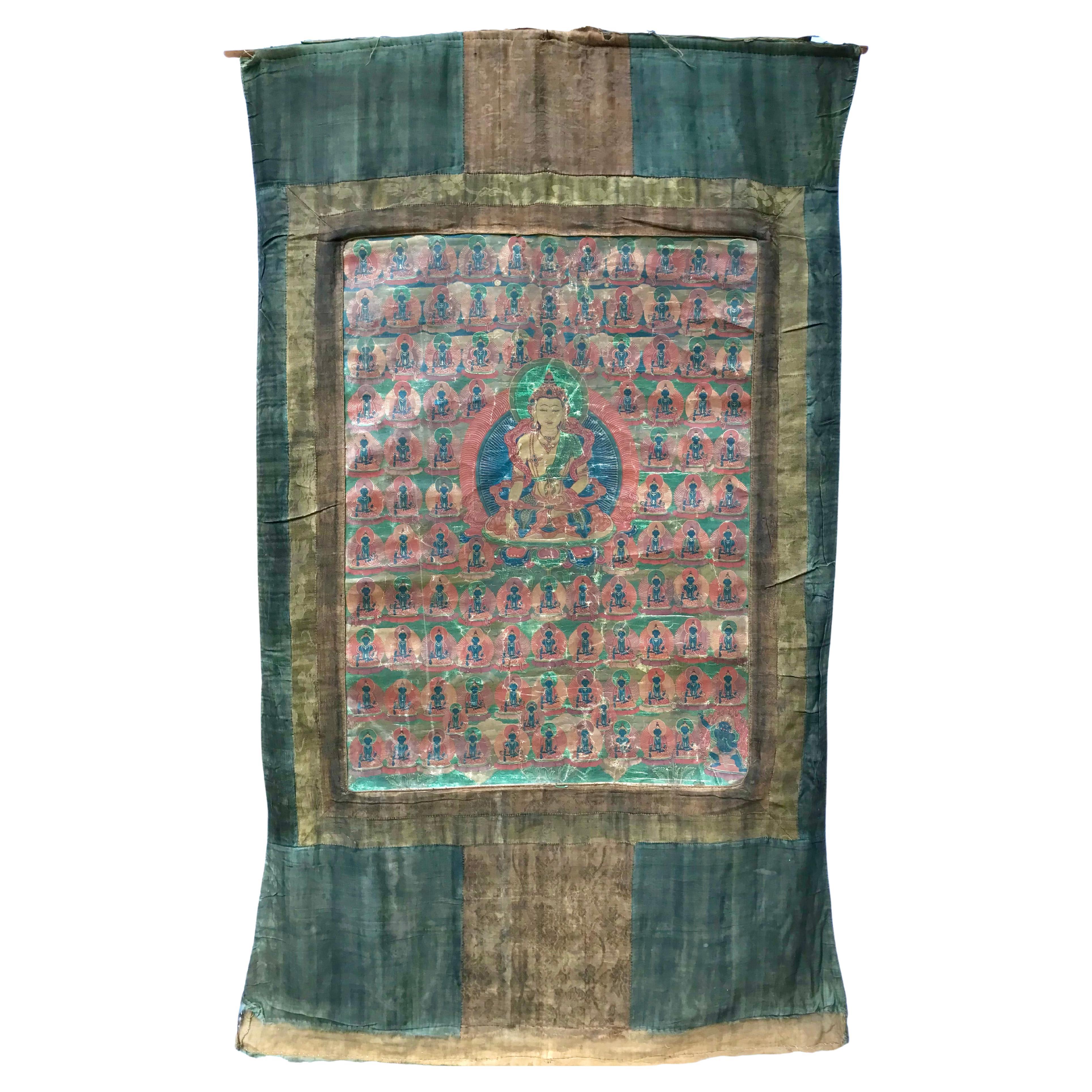A THANGKA DEPICTING AMITAYUS, 18TH CENTURY

Tibet. Distemper on cloth, with a silk brocade frame, mounted as a hanging scroll with wood handles. Finely painted with Amitayus seated in dhyanasana atop a lotus throne, his hands in bhumisparsamudra, a