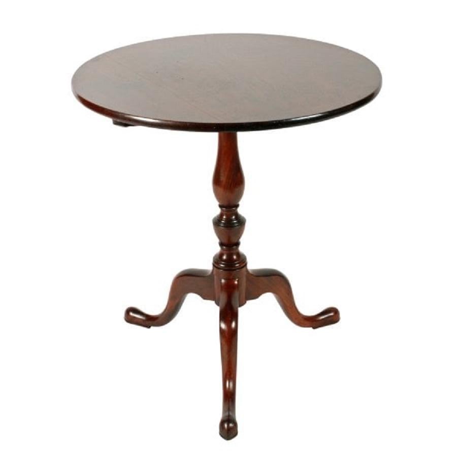 An 18th century Georgian mahogany tip top tripod table.

The table has a figured mahogany circular top with a release catch underneath that allows the top to tip.

The base has three cabriole legs with shaped toes and a turned stalk that has a