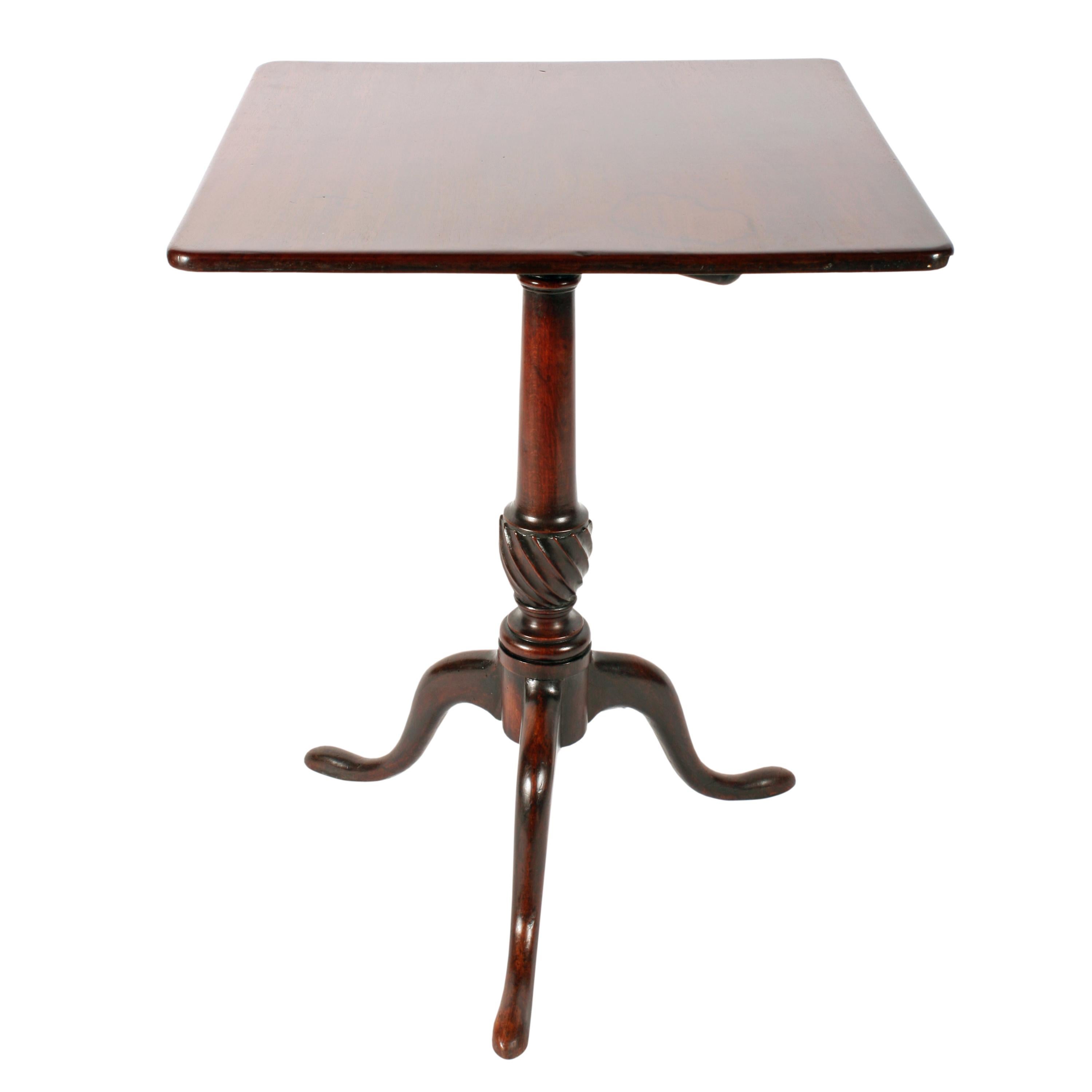 A late 18th century Georgian mahogany square tip top tripod table.

The top has a twist locking catch underneath which unlocks and allows the top to tip.

The base has three cabriole legs and a turned tapering stalk that has a decorative spiral