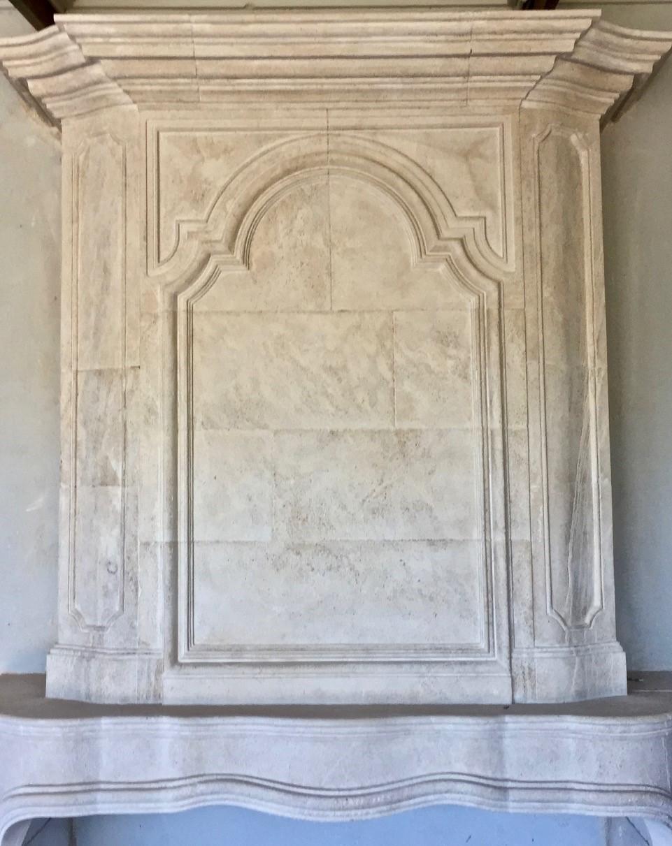 A perfect 18th century limestone fireplace mantel Trumeau reedition. Elegant an ideal in almost any home.



 