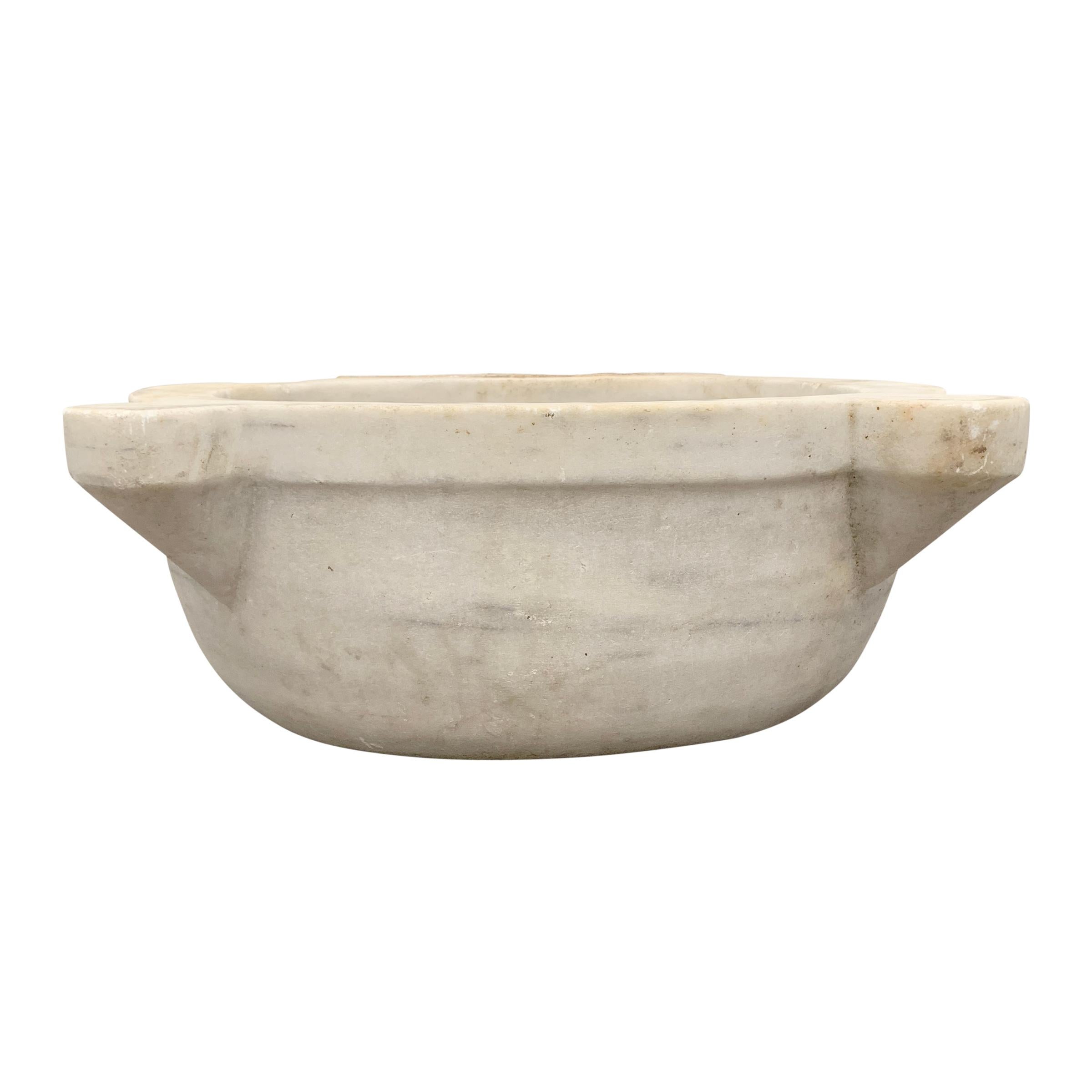A wonderful 18th century Turkish Hammam carved white marble sink vessel with a wonderfully worn finish. A drain could be drilled in the bottom to convert into a sink.

Interior dimension: 17.5 in. W x 13.75 in. D x 8 in. H.