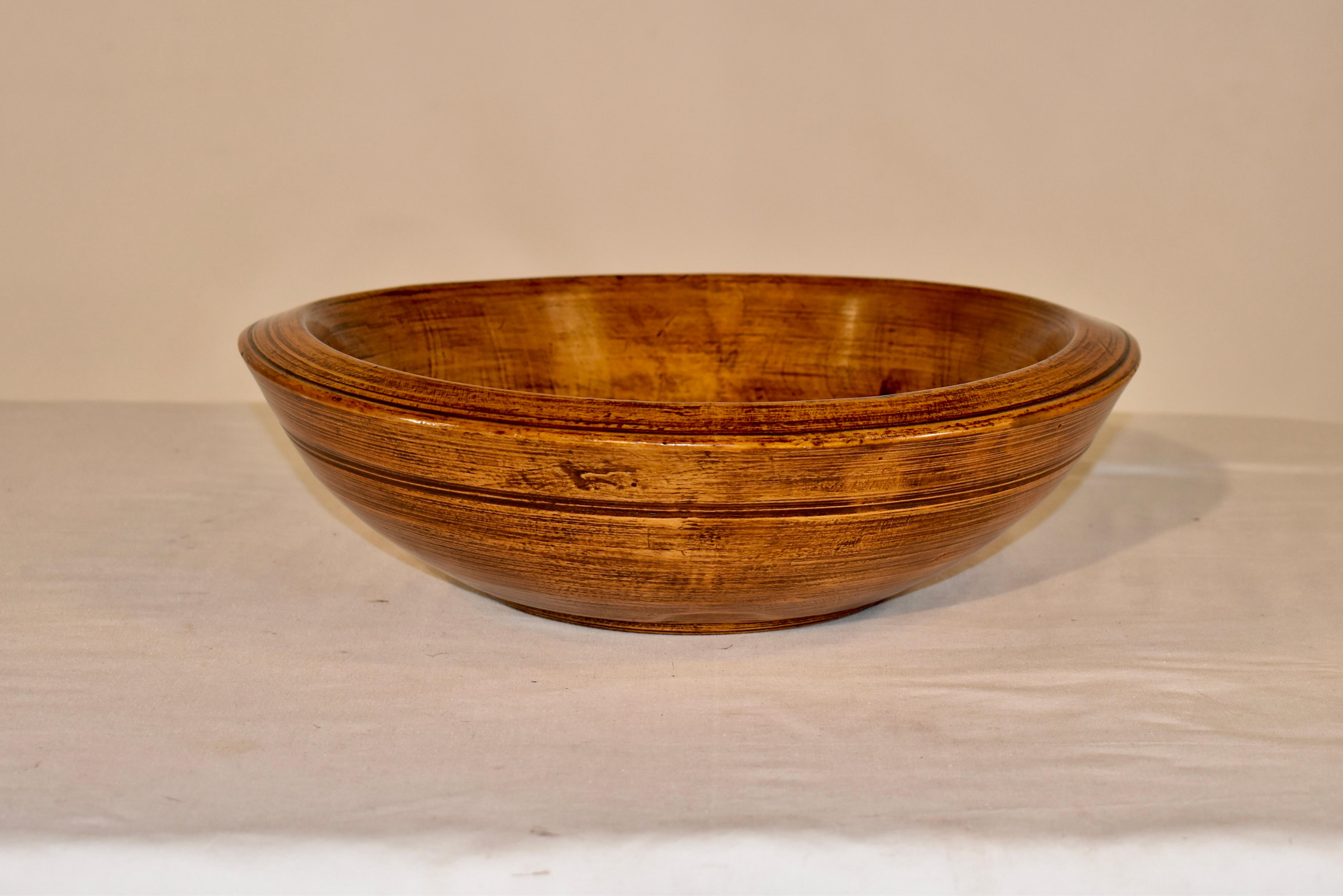 18th century Holm oak bowl from France.  The bowl is beautifully hand turned  and has a rich color and patina and shows honest signs of use.  This type of bowl may have been used in a dairy or on a farm for gathering.  It will be a lovely addition