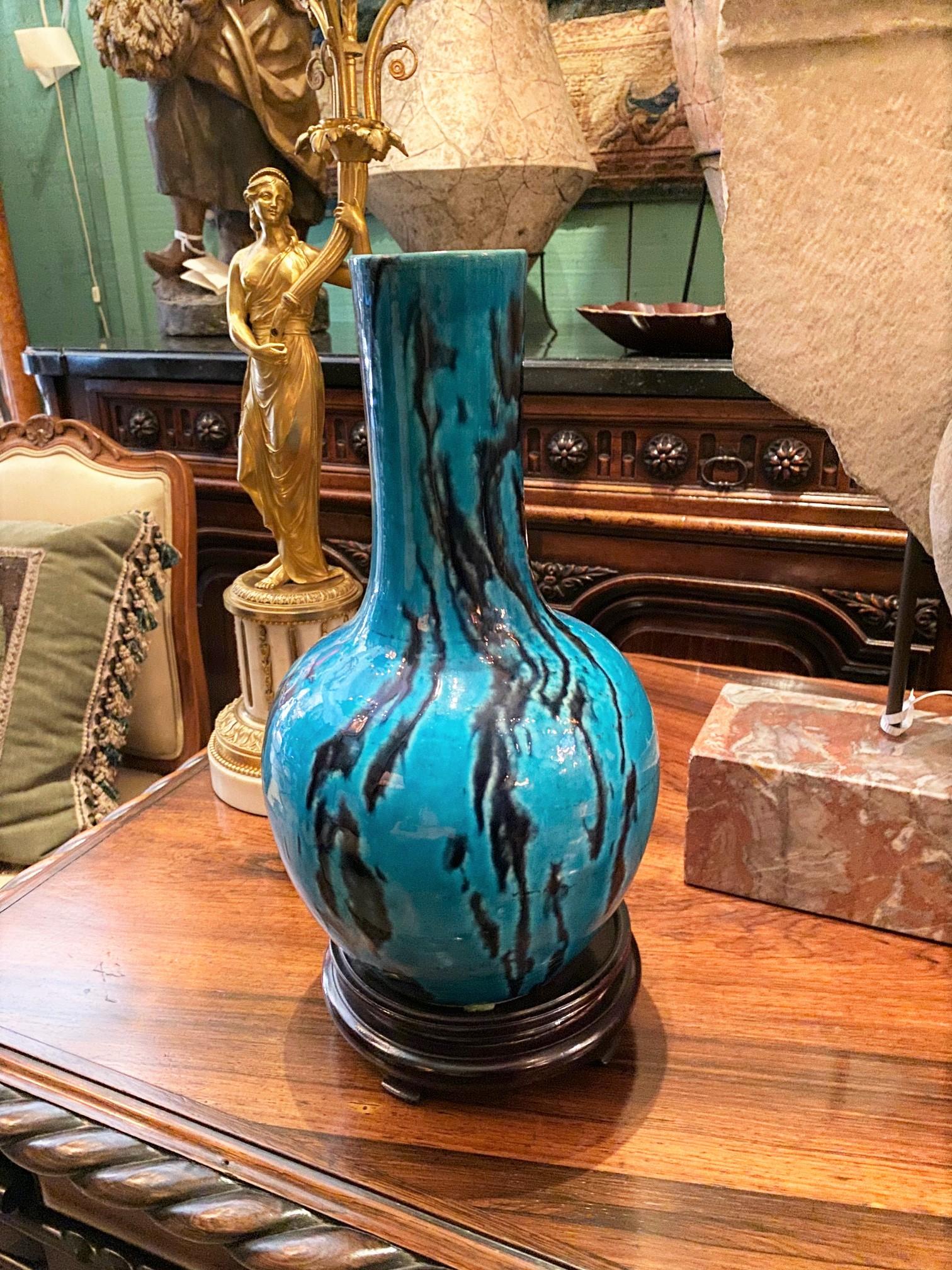 A very Fine 18th century Chinese chinoiserie blue and pottery vase or jar bottle, of typical vasiform shape with medium and deep blue decoration. Hand painted in shades of cobalt blue. it comes with a hand carved wood base as a Stand. A Very nice