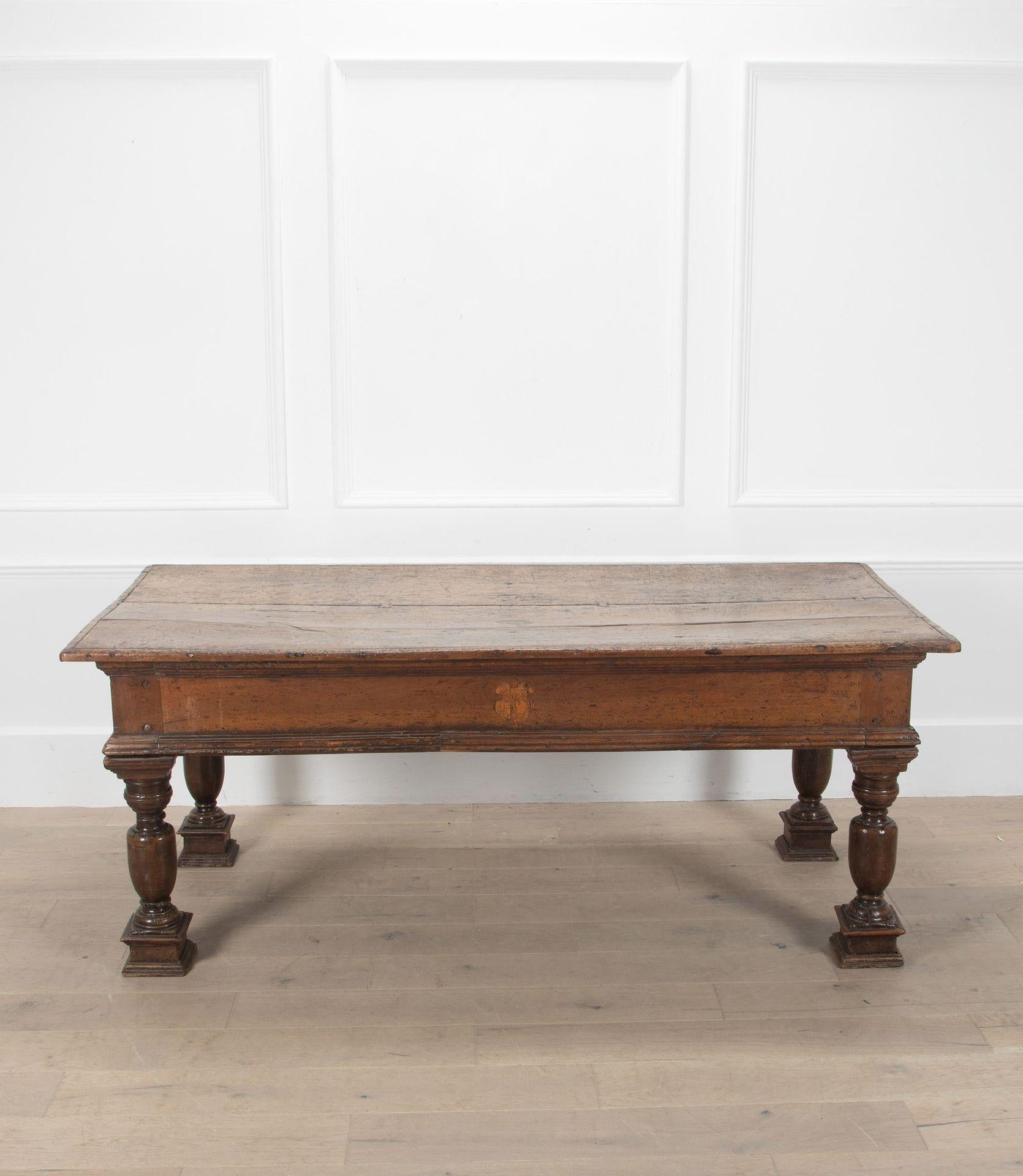 18th Century Tuscan centre table in walnut with inlay motifs on each side.

With a richly aged patina.