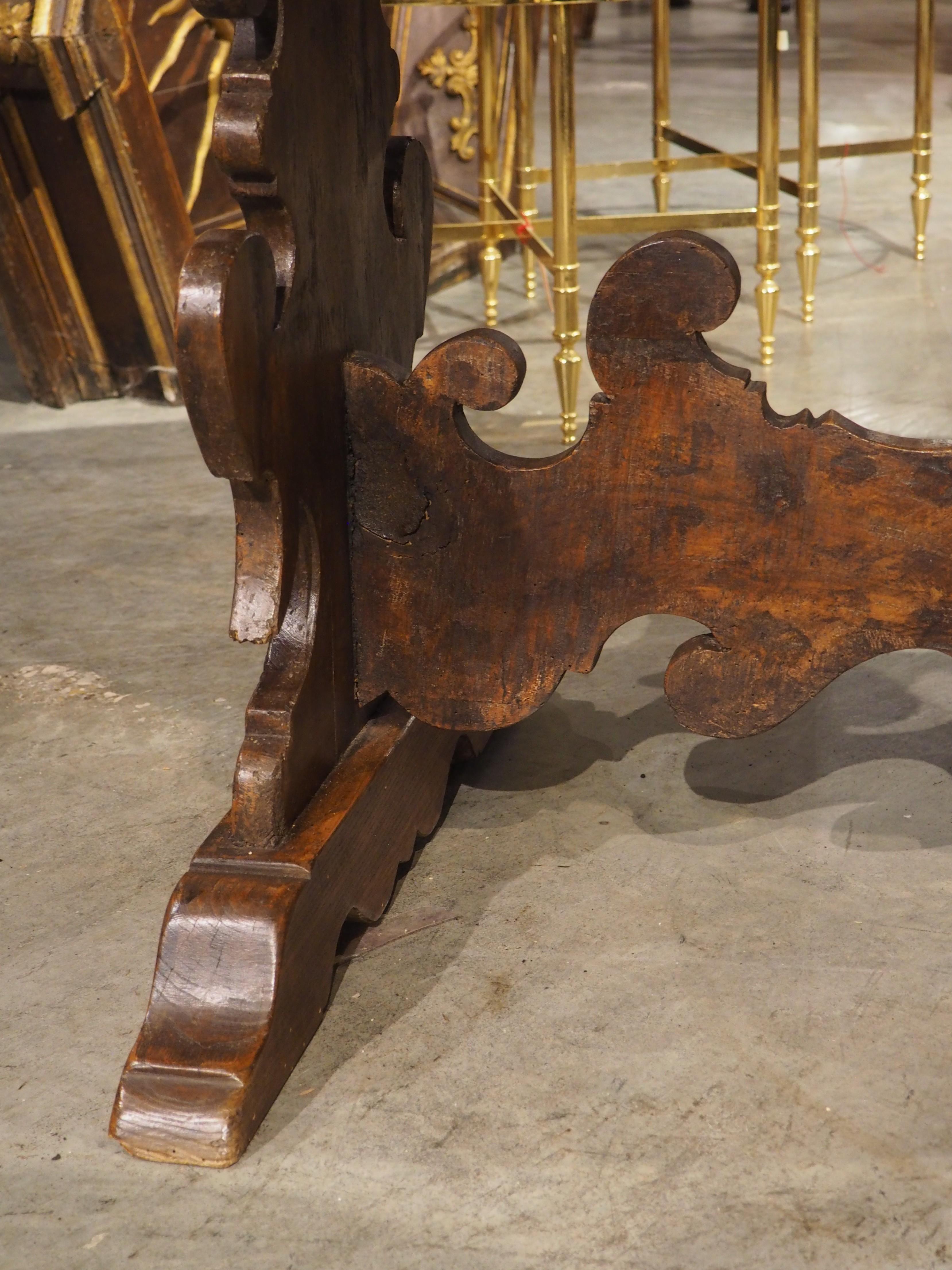 More information coming soon…

When not in use, this Italian oval drop leaf table has a depth of only 18 1/2 inches, allowing it to be stored where space is at a premium.  Hand-carved in the 1700s, the walnut wood has a dark brown patina that