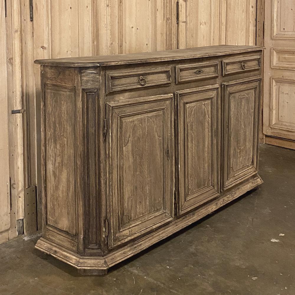 18th century Tuscan walnut buffet displays the essence of the country furniture from the storied rural region in today's Italy. Handcrafted from indigenous walnut, it features tailored panels with fine molded detail, combined with capacious storage
