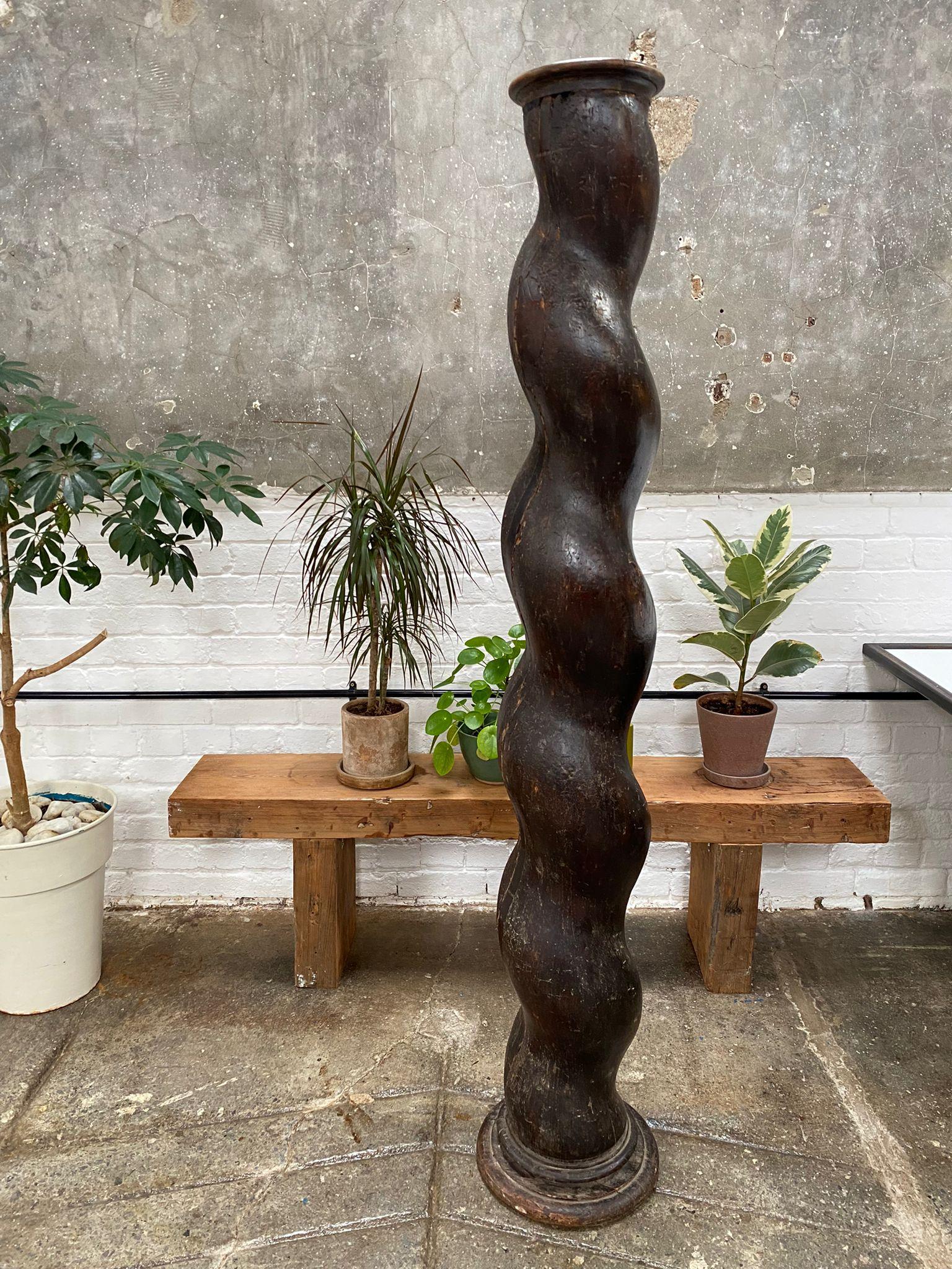 A stunning rich, textural, sculptural column. It is a gentle twist, hand carved, perfect for showing sculpture, floral displays, adding an ancient architectural element to a room. I love this piece! 

It is stable and heavy, tall and good looking.