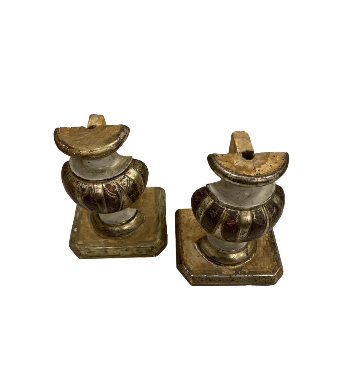 Here is a unique pair of 18th Century urn fragments in original paint and gilt. These feature a range of colors that add just a small pop of hue to any space. These fragments would make a great asset in a bookcase, library, a top a mantel or on a
