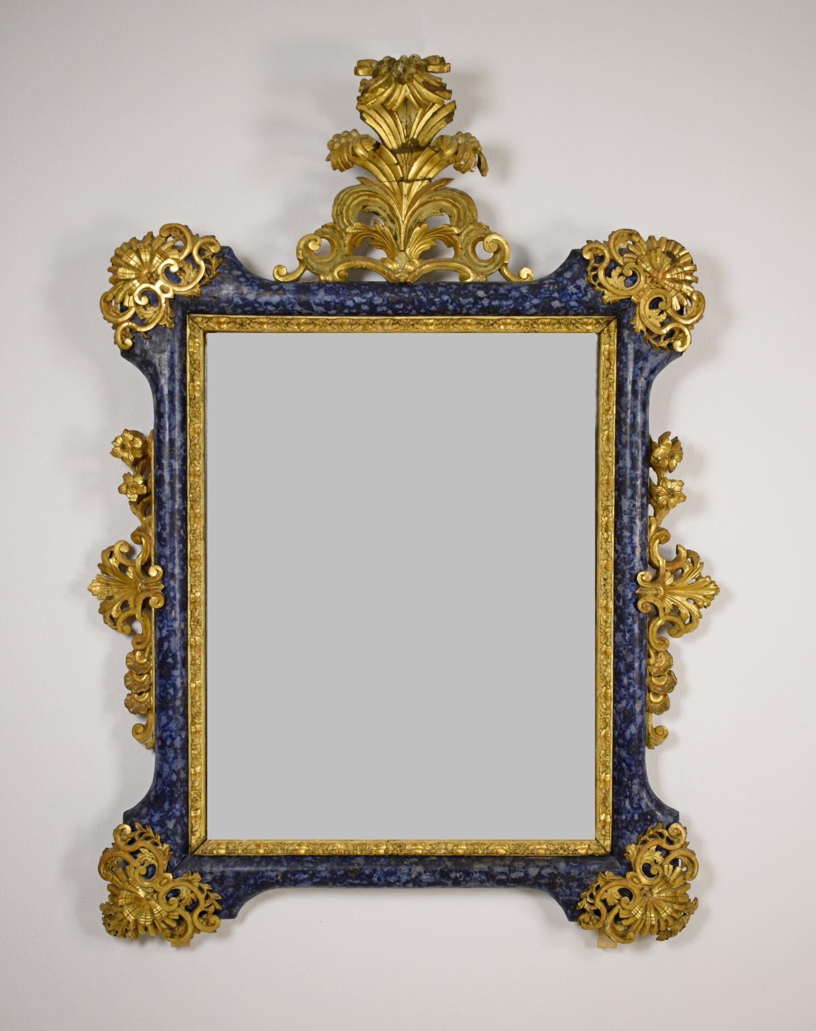 18th Century, Italian Venetian Baroque Lacquered giltwood Mirror 

This wonderful Baroque mirror was made in Venice (Italy), around the middle of the 18th century, in lacquered, carved and gilded wood.
It consists of a rectangular frame in gilded