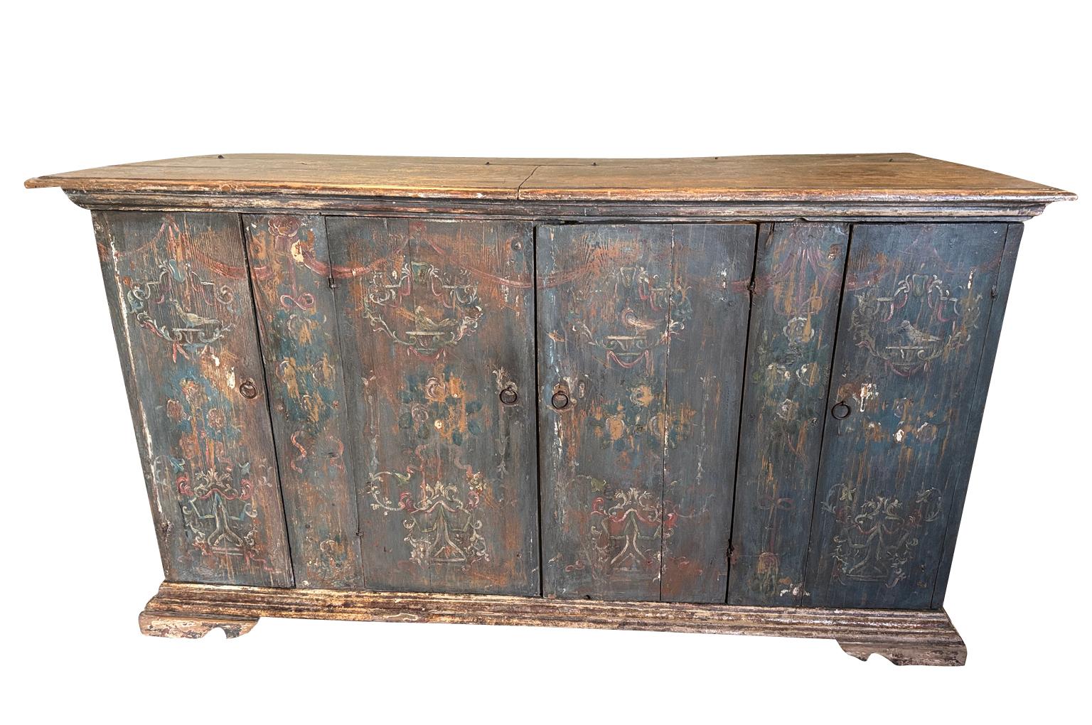 A very beautiful 18th century Credenza from Venice, Italy.  Soundly constructed from pine having a rectangular top with a molded edge finish atop a conforming case and interior shelving, raised on bracket feet.  This wonderful Credenza retains its