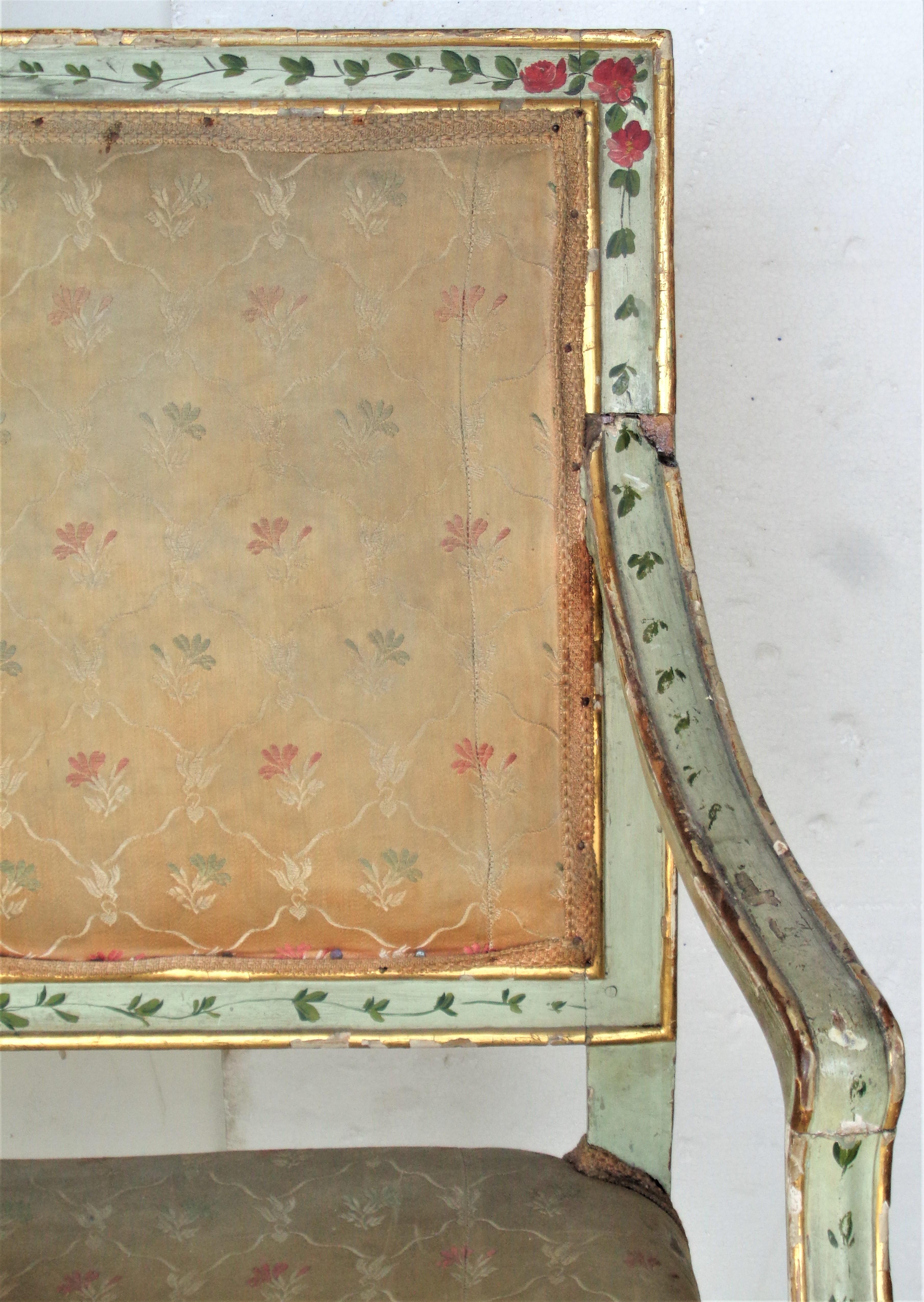 `Antique 18th century Venetian settee in beautifully aged old painted and worn parcel gilded surface. Early construction. Losses to gilding showing underlying gesso and bare wood. Pale green paint on front and blue green paint on rear are original.