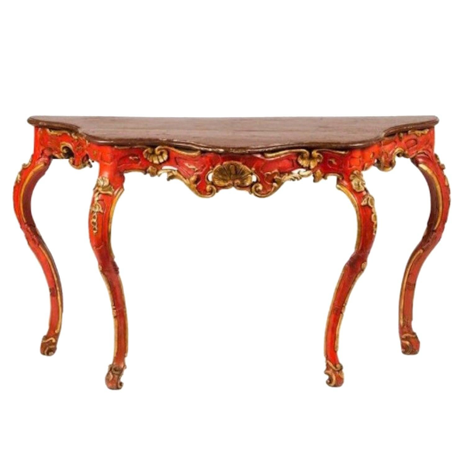 18th century venetian red painted parcel-gilt serpentine console table. Boldly delicate, this console is a showstopper in any room. The red and parcel-gilt finish is unique. Unpainted original wood top. Perfect in an entryway or living area to hold