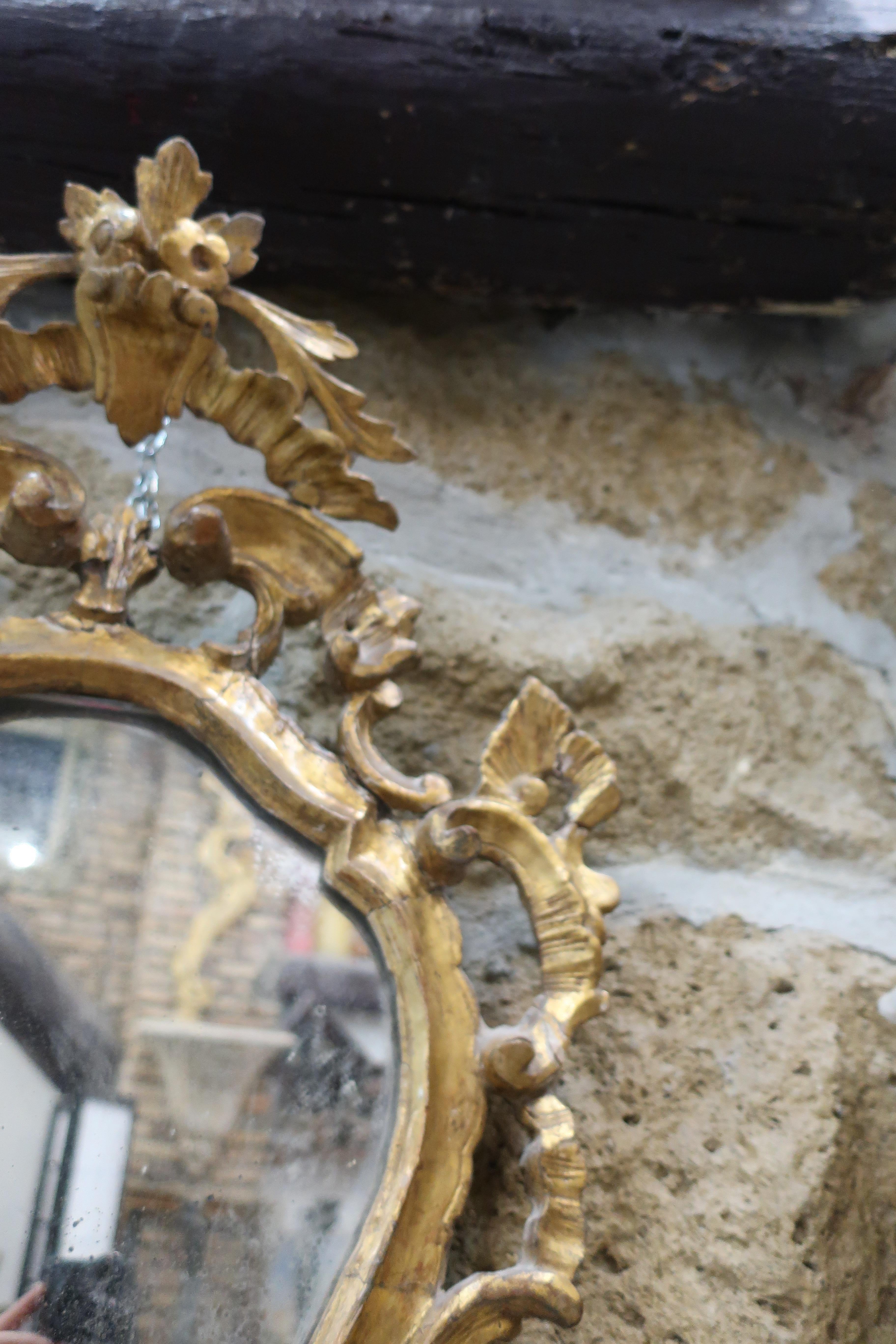 Wood 18th Century venetian Rococò gilded wood mirror in pure gold For Sale